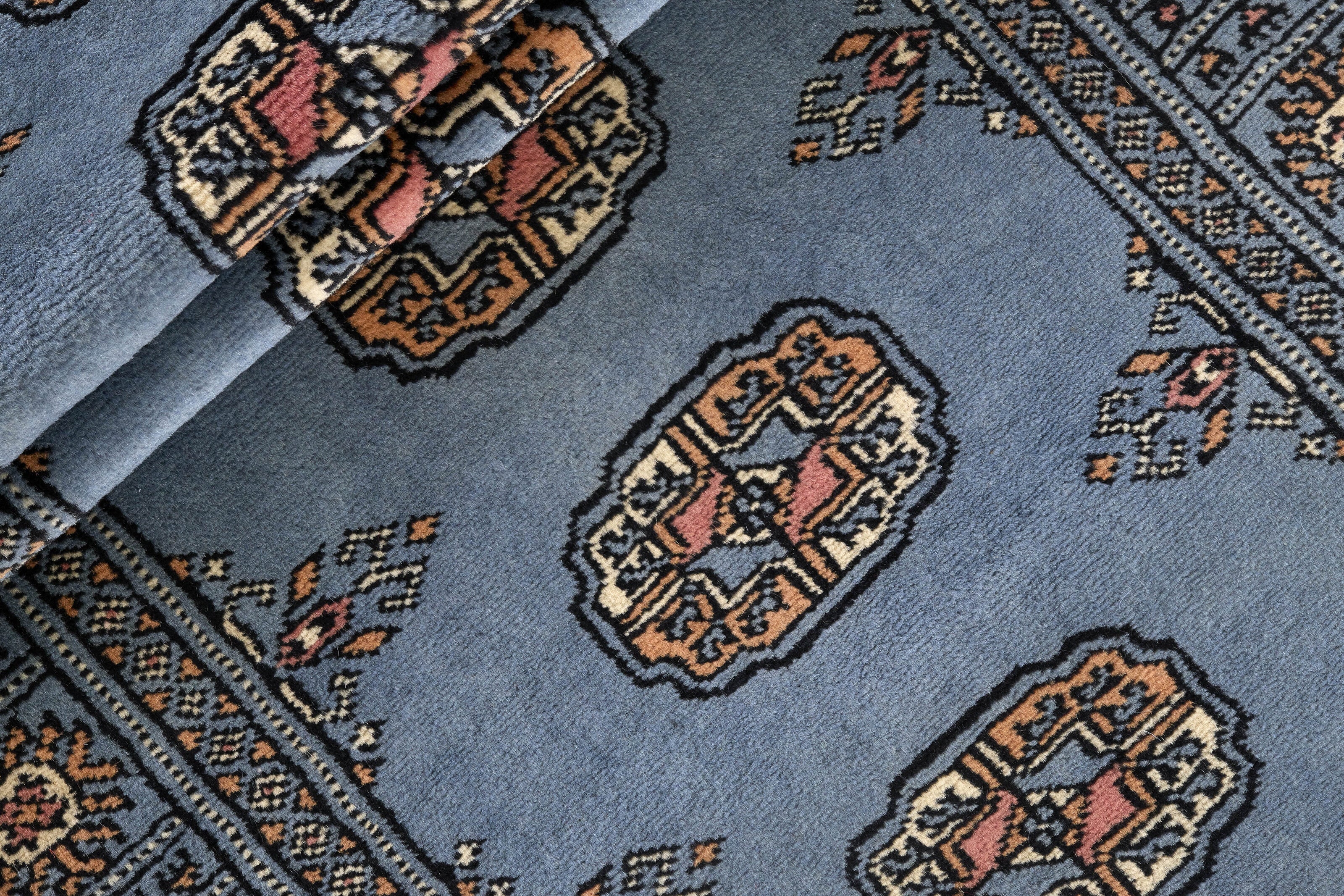 Blue Oriental runner with traditional bordered pattern