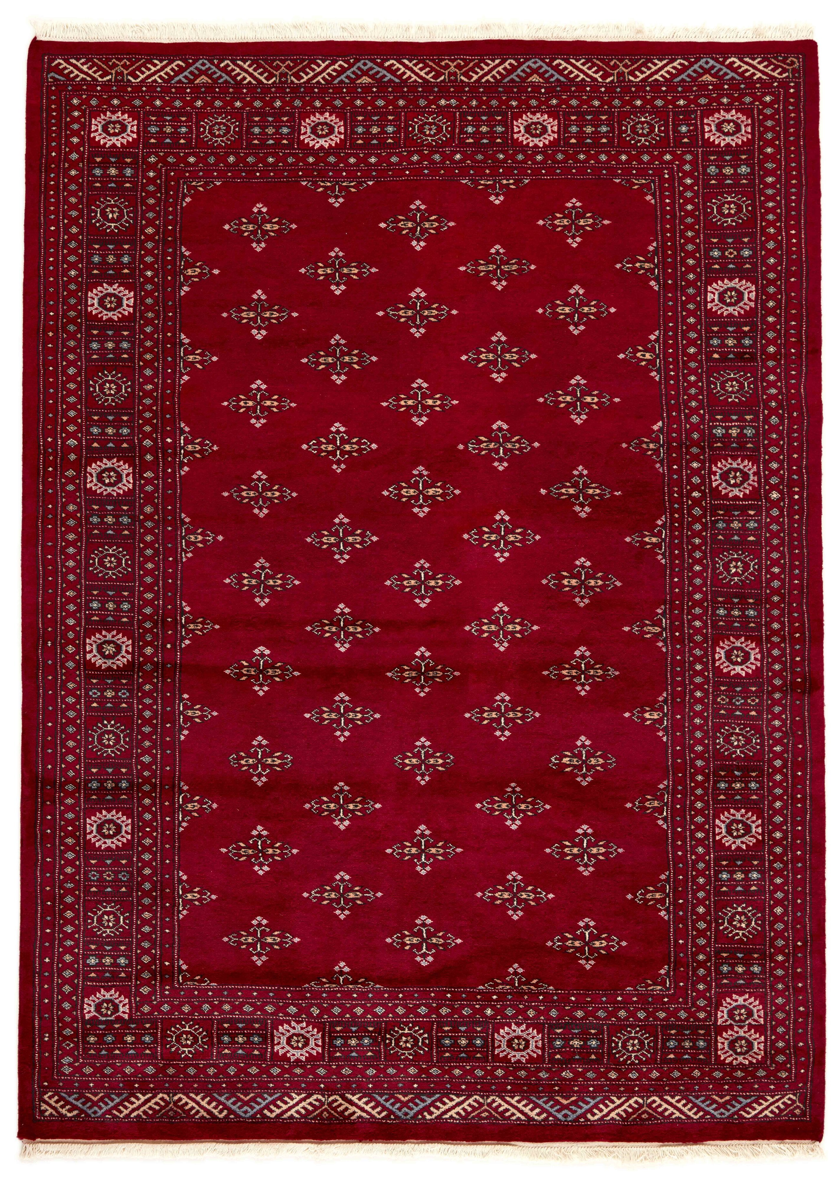 Red Oriental rug with traditional bordered pattern