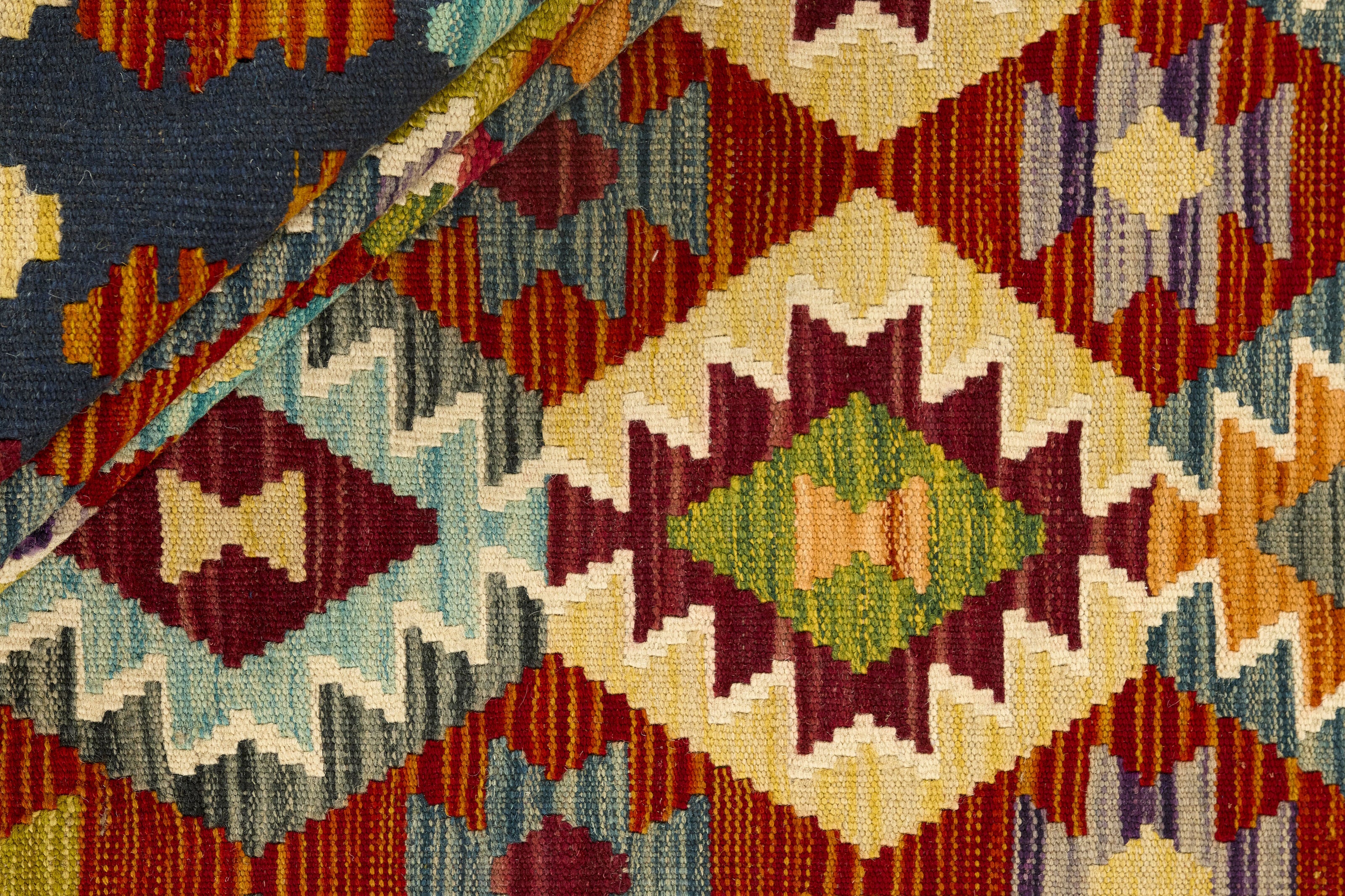 Authentic Afghan Kelim flatweave rug with traditional multicolour pattern.

