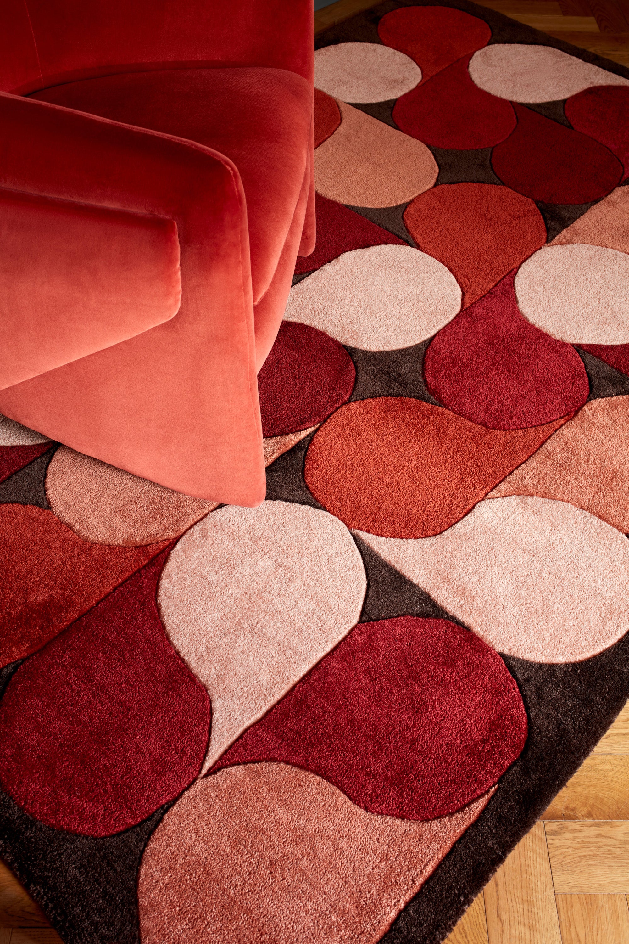 Red rug with an abstract pattern