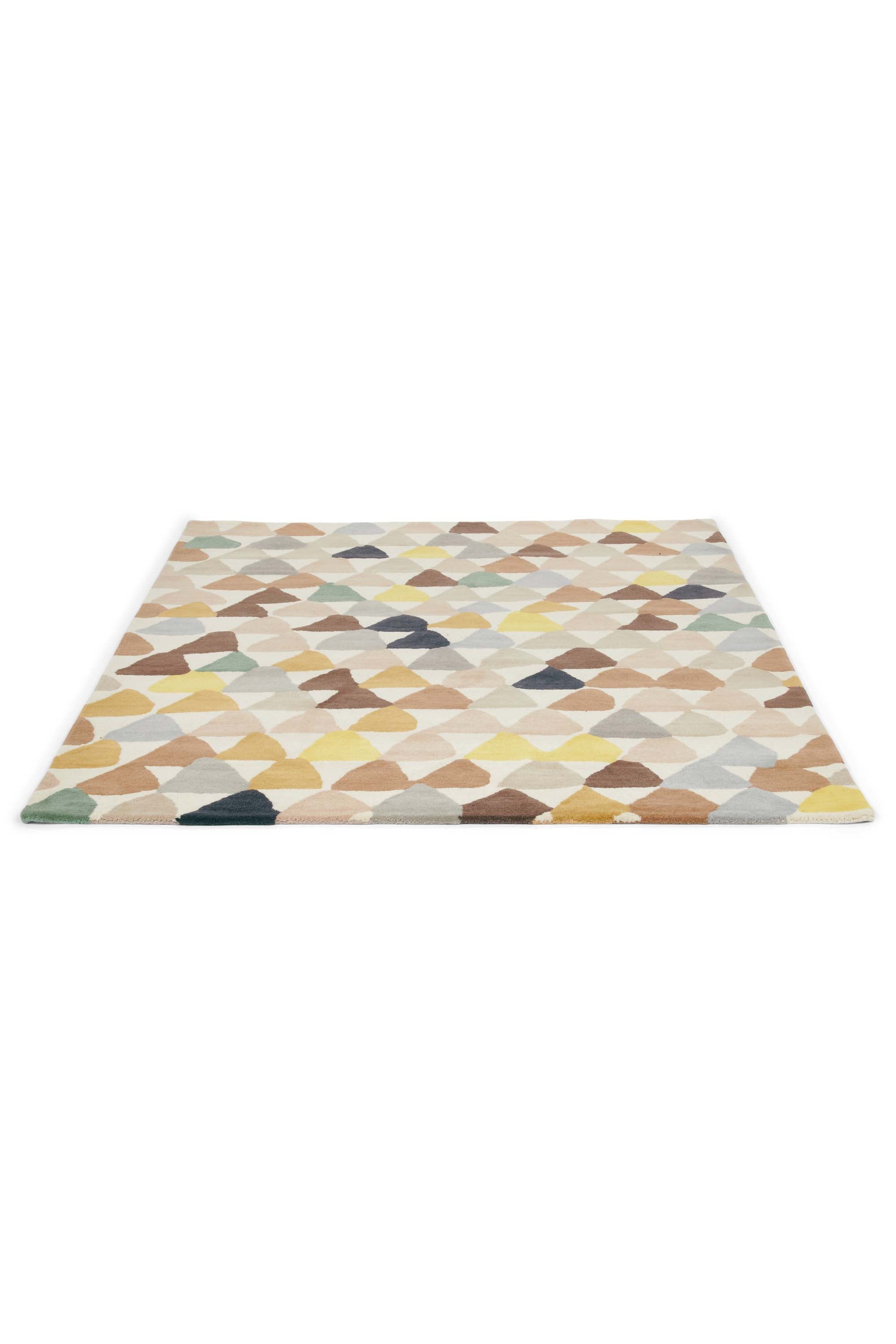 Cream rug with green and blue geometric pattern