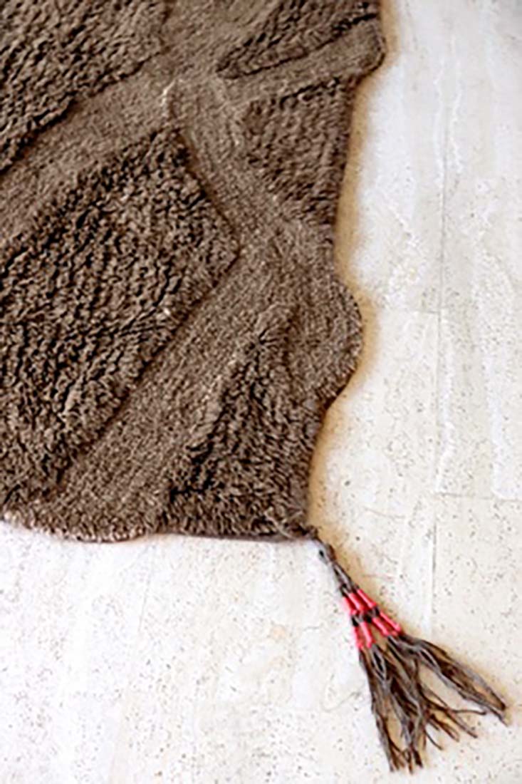 textured brown area rug
