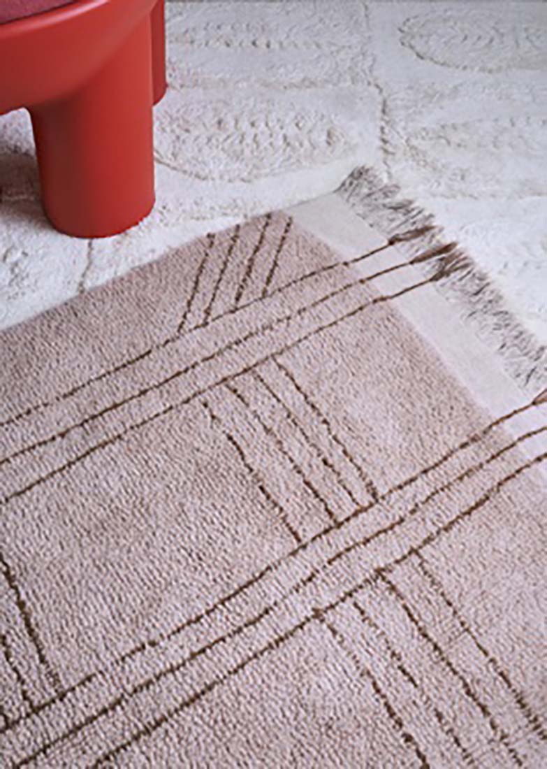 dusty pink area rug with tribal design
