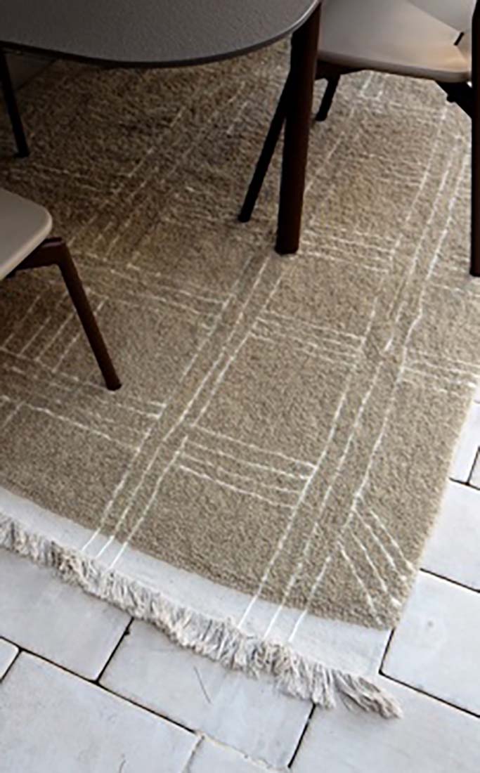 beige area rug with tribal design
