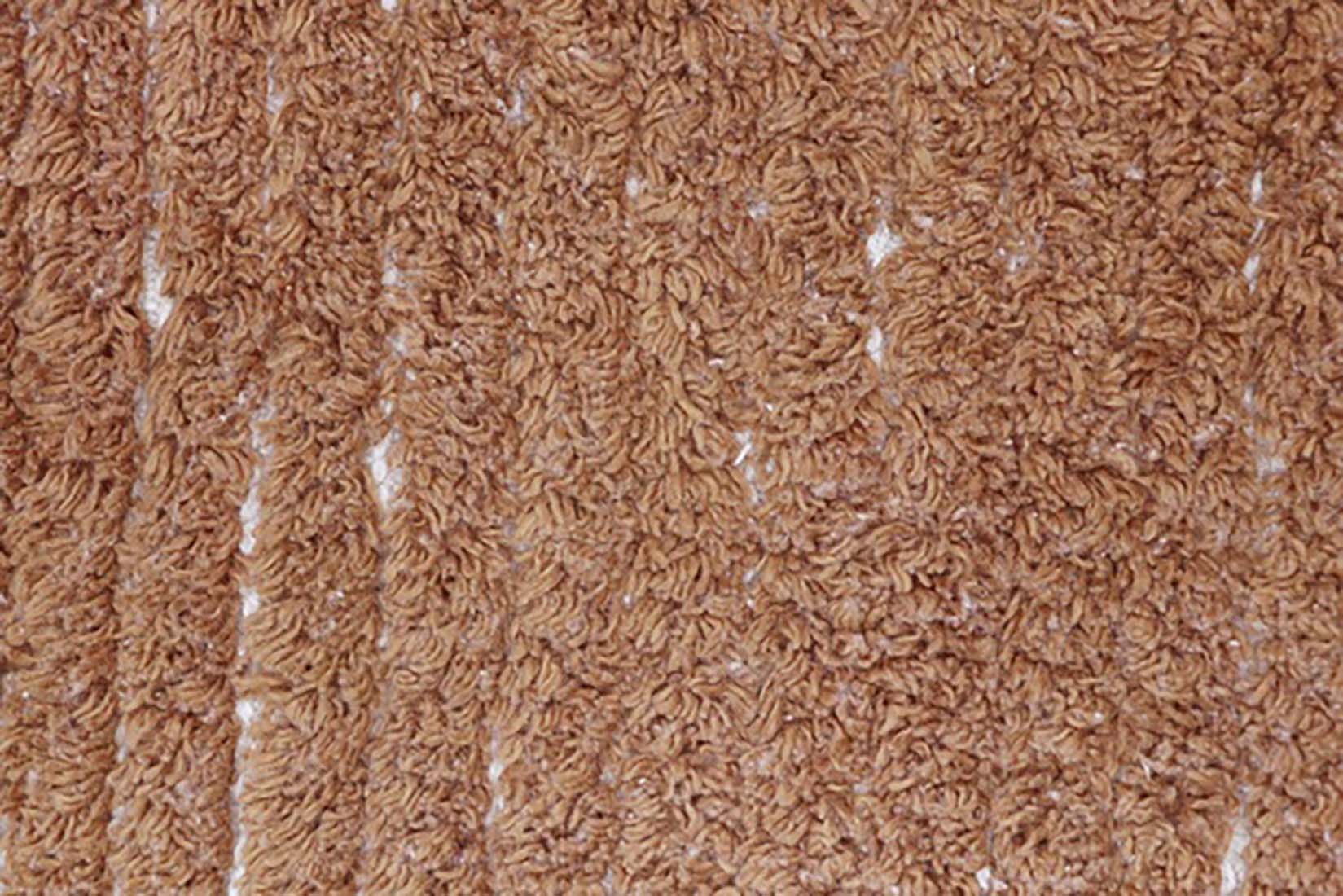 reversible textured rug in beige and brown
