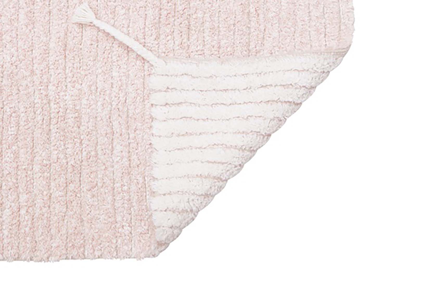 reversible textured rug in pink and ivory with ombre design
