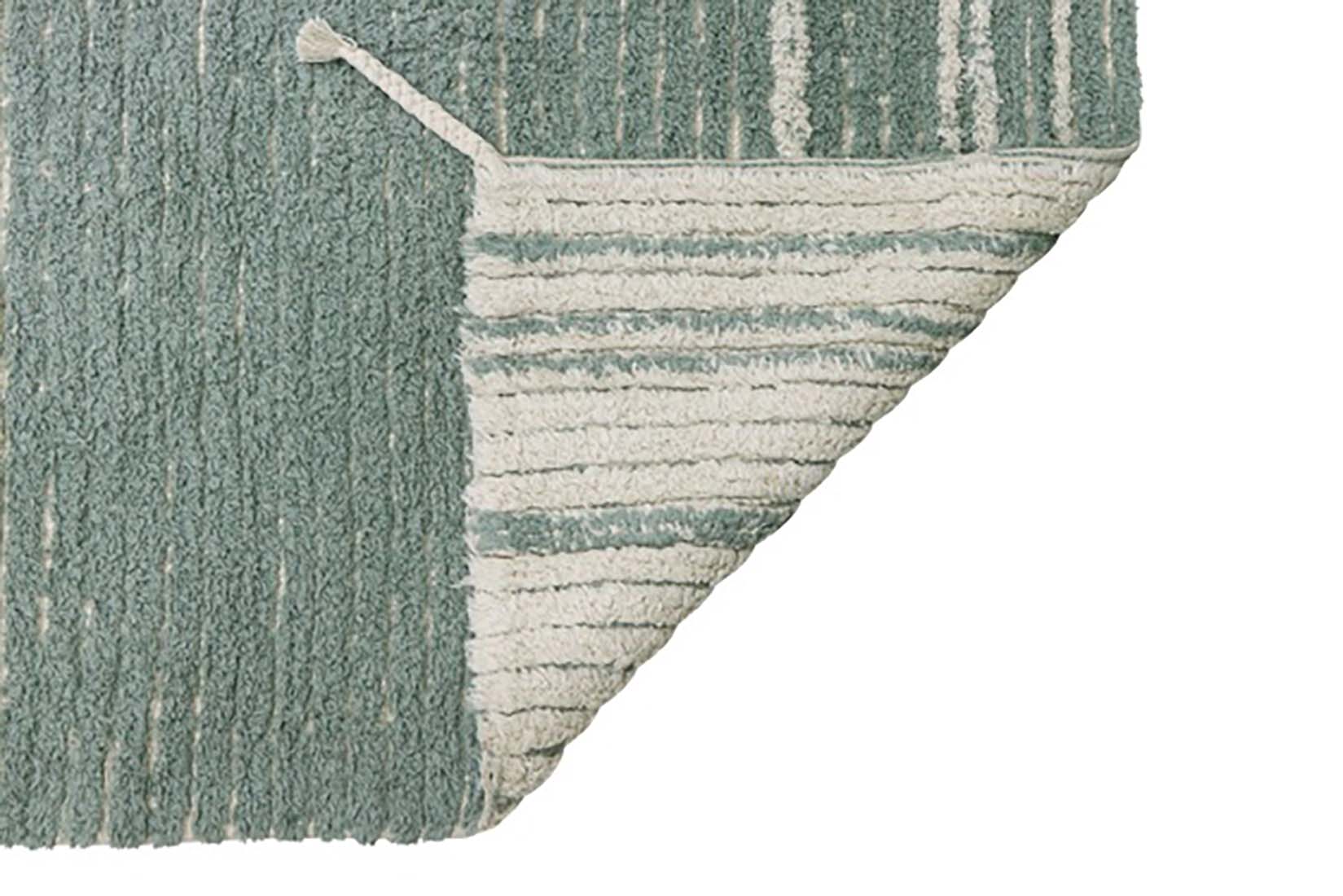 reversible textured rug in beige and blue with soft gradient design
