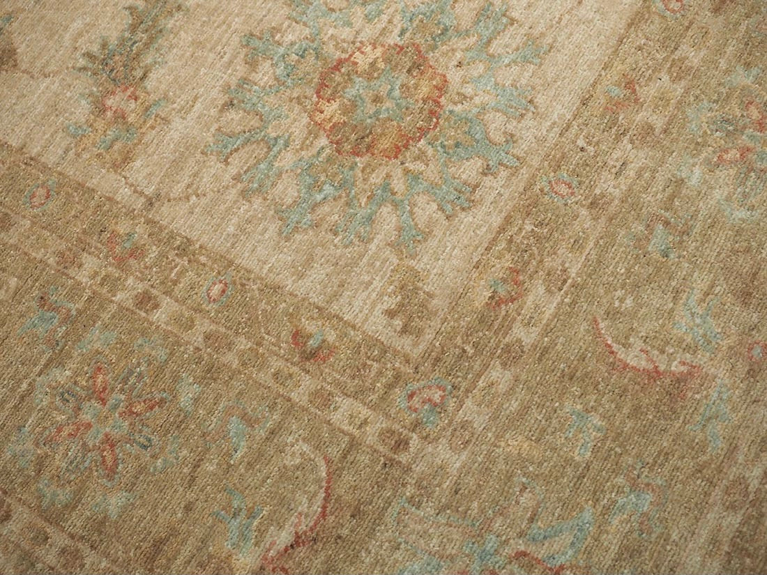 Authentic oriental rug with delicate floral pattern in beige