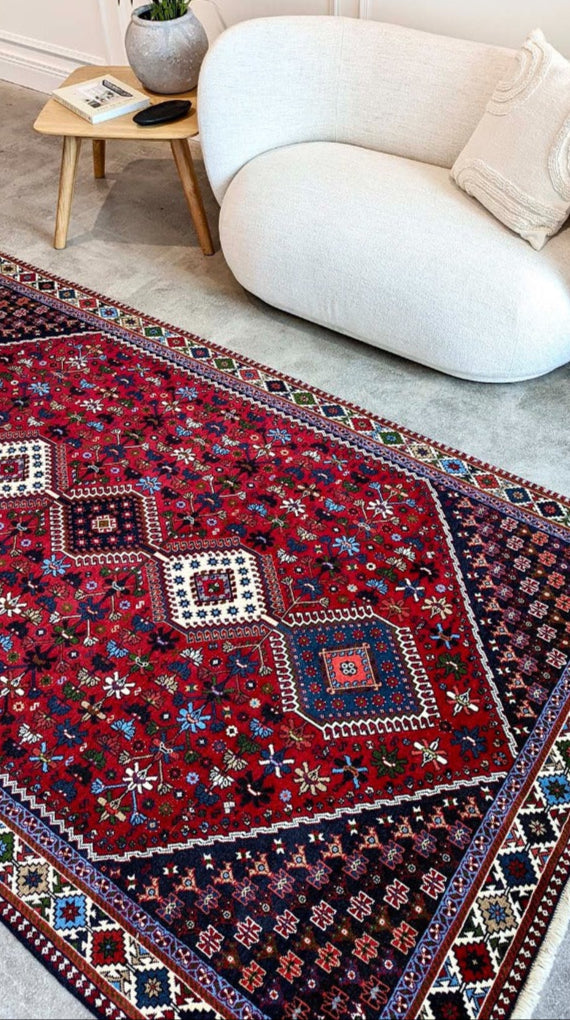 red Authentic persian rug with a traditional design