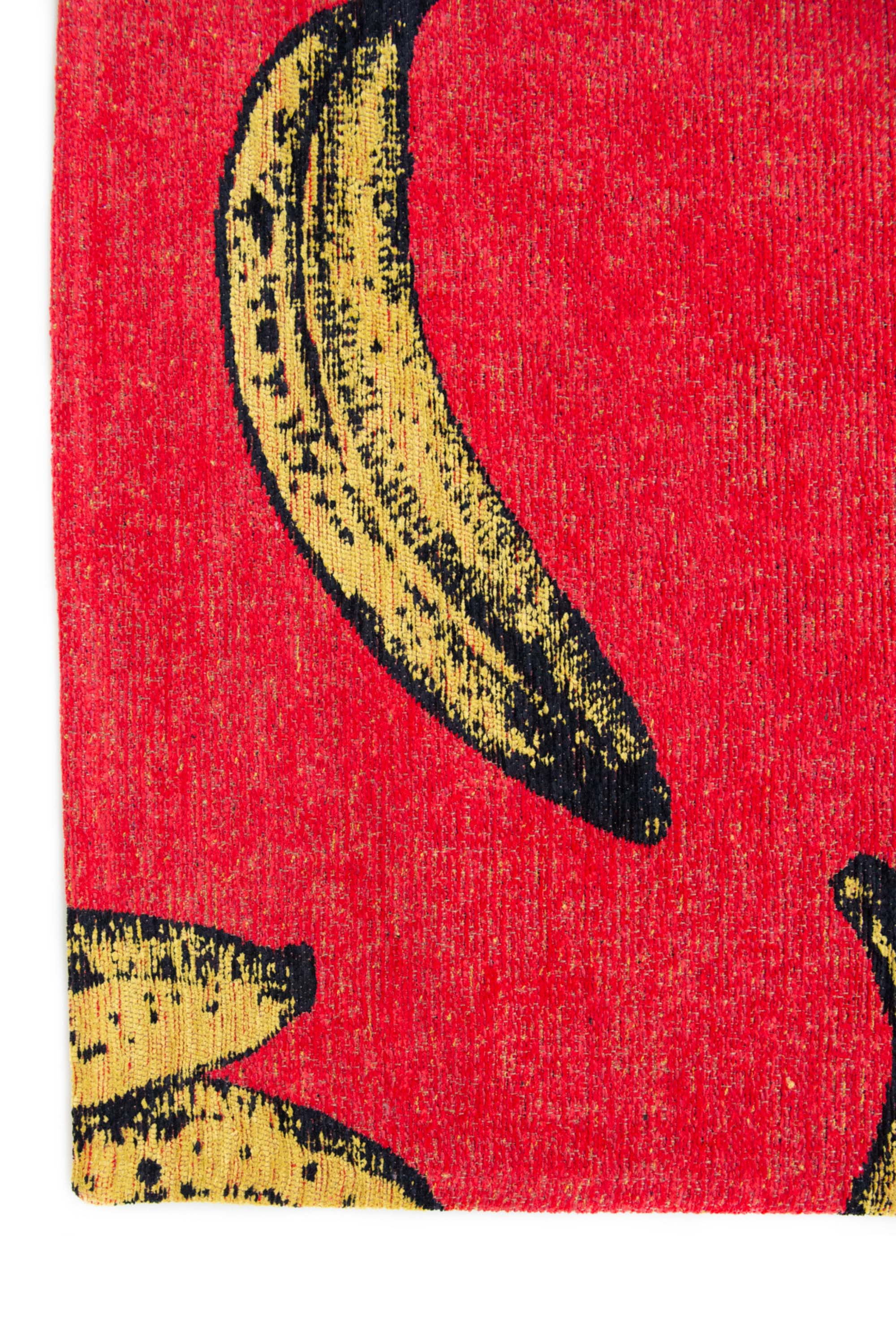 Modern red rug with repeated banana motif