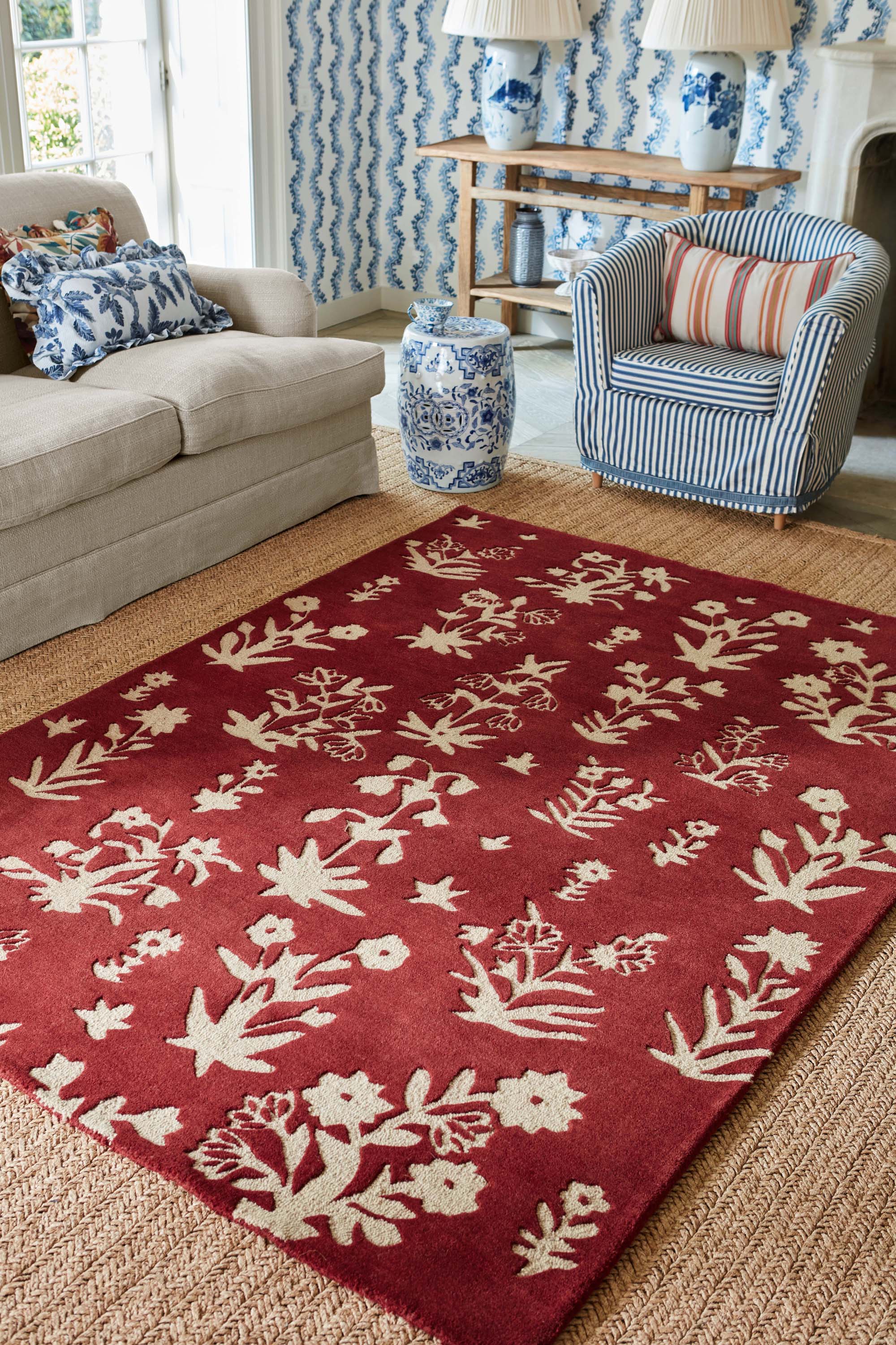 Red rug with cream floral motif