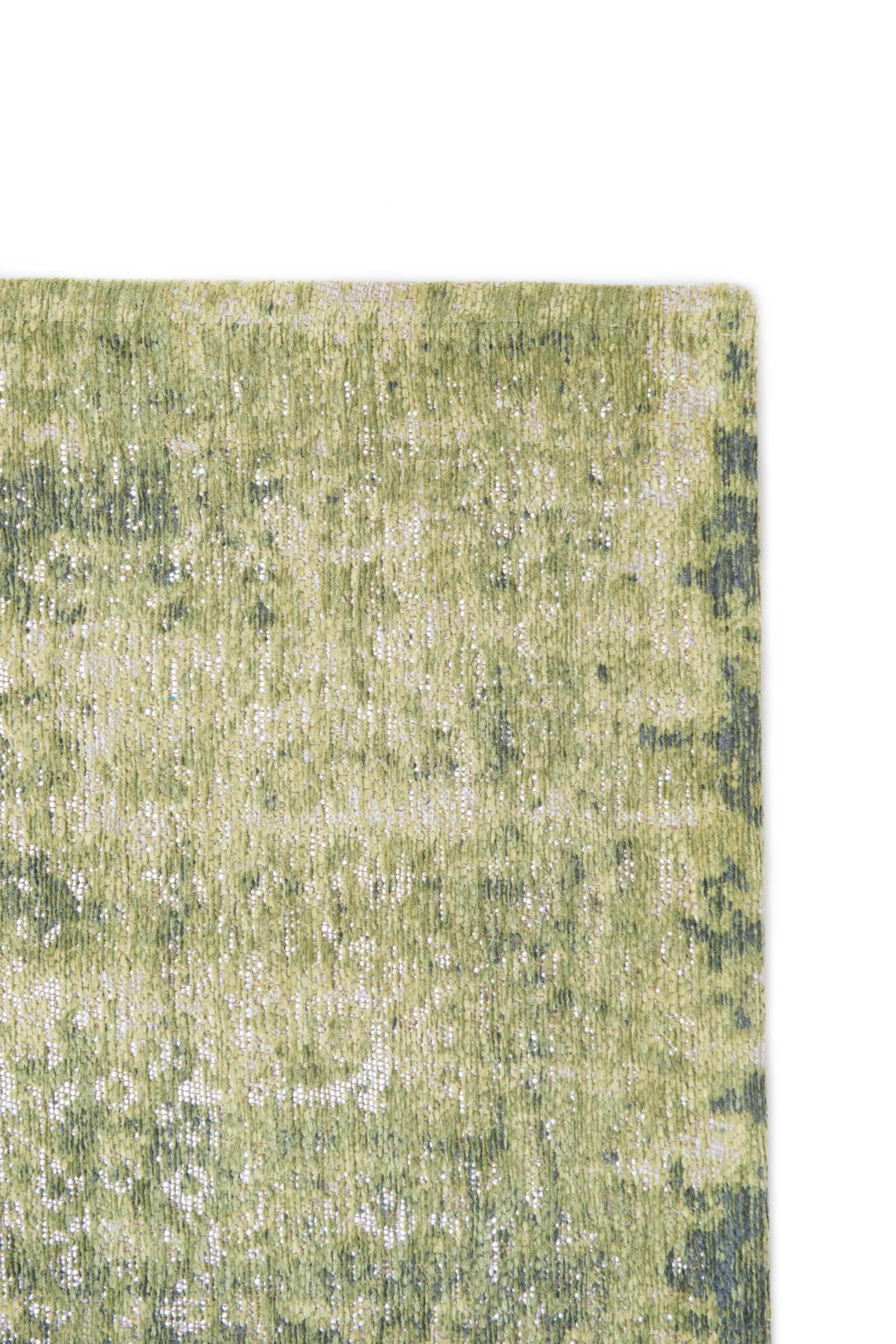 Green vintage Kirman-inspired rug with faded medallion pattern