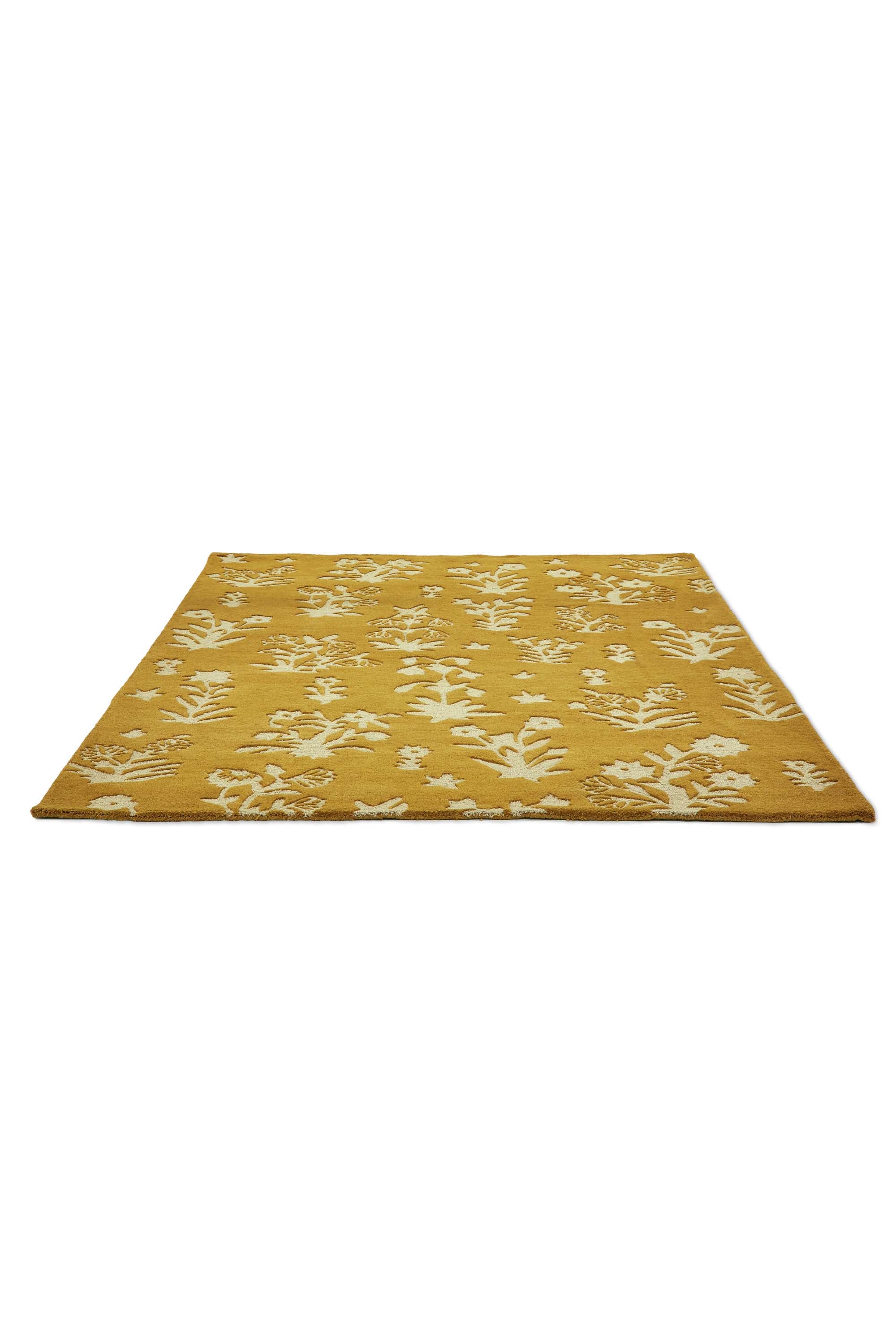 Gold rug with cream floral motif