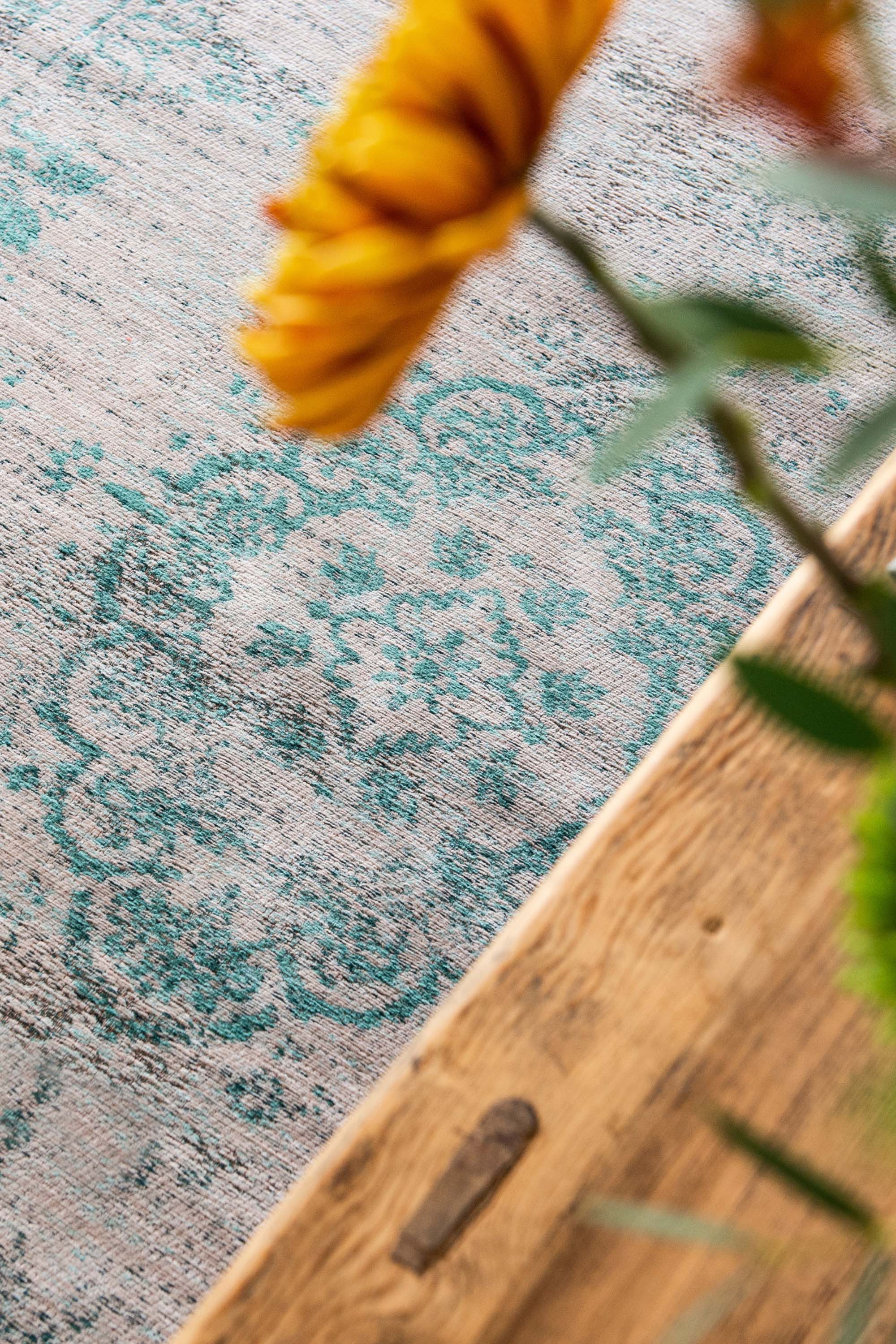 Grey flatweave rug with faded green persian design