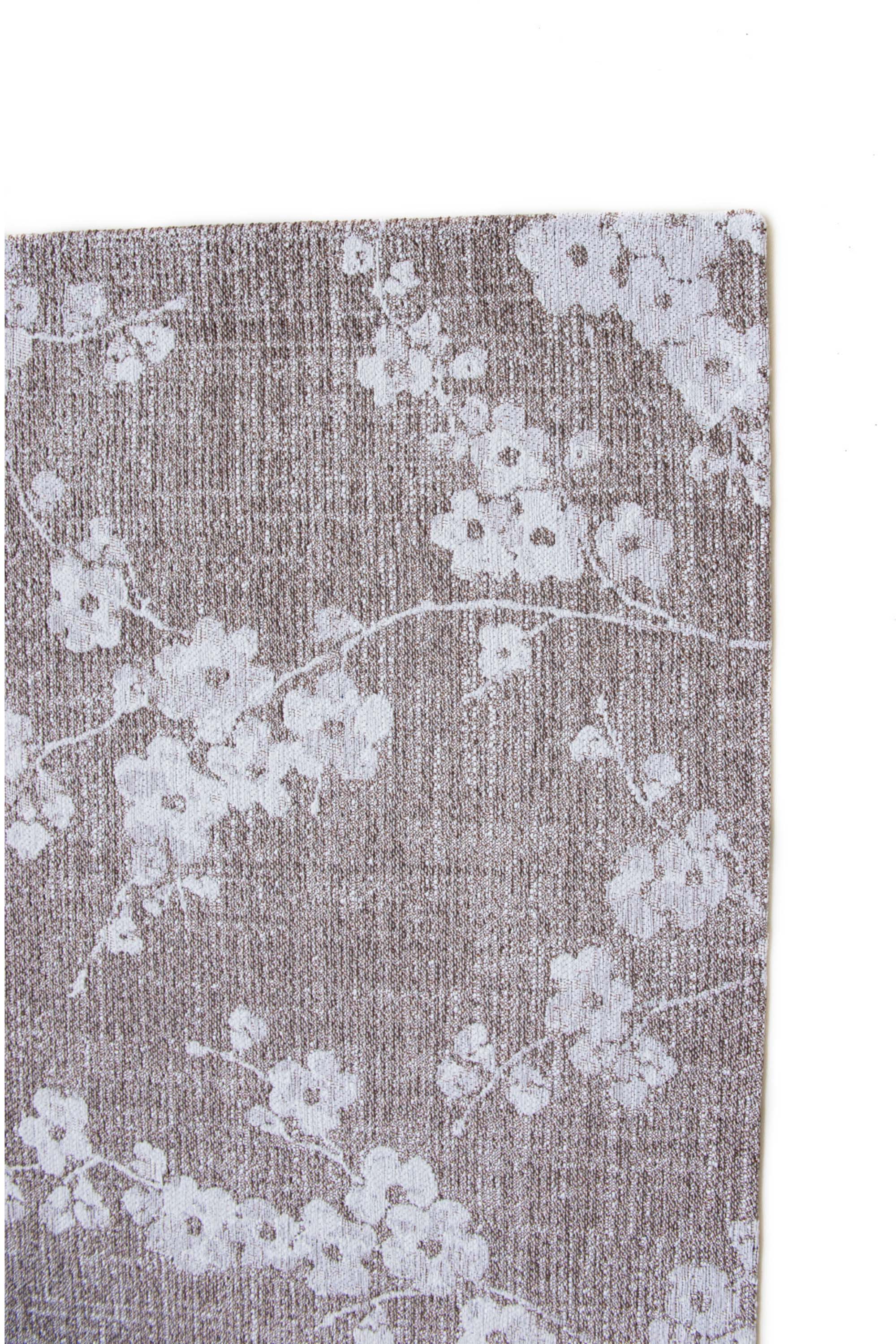 Modern abstract rug with subtle beige floral pattern