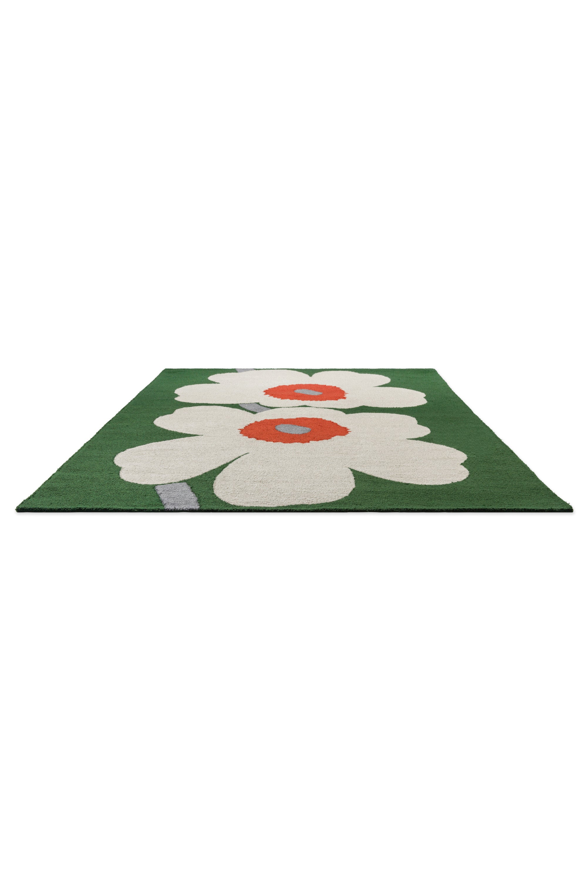 Green rug with white and orange floral motif