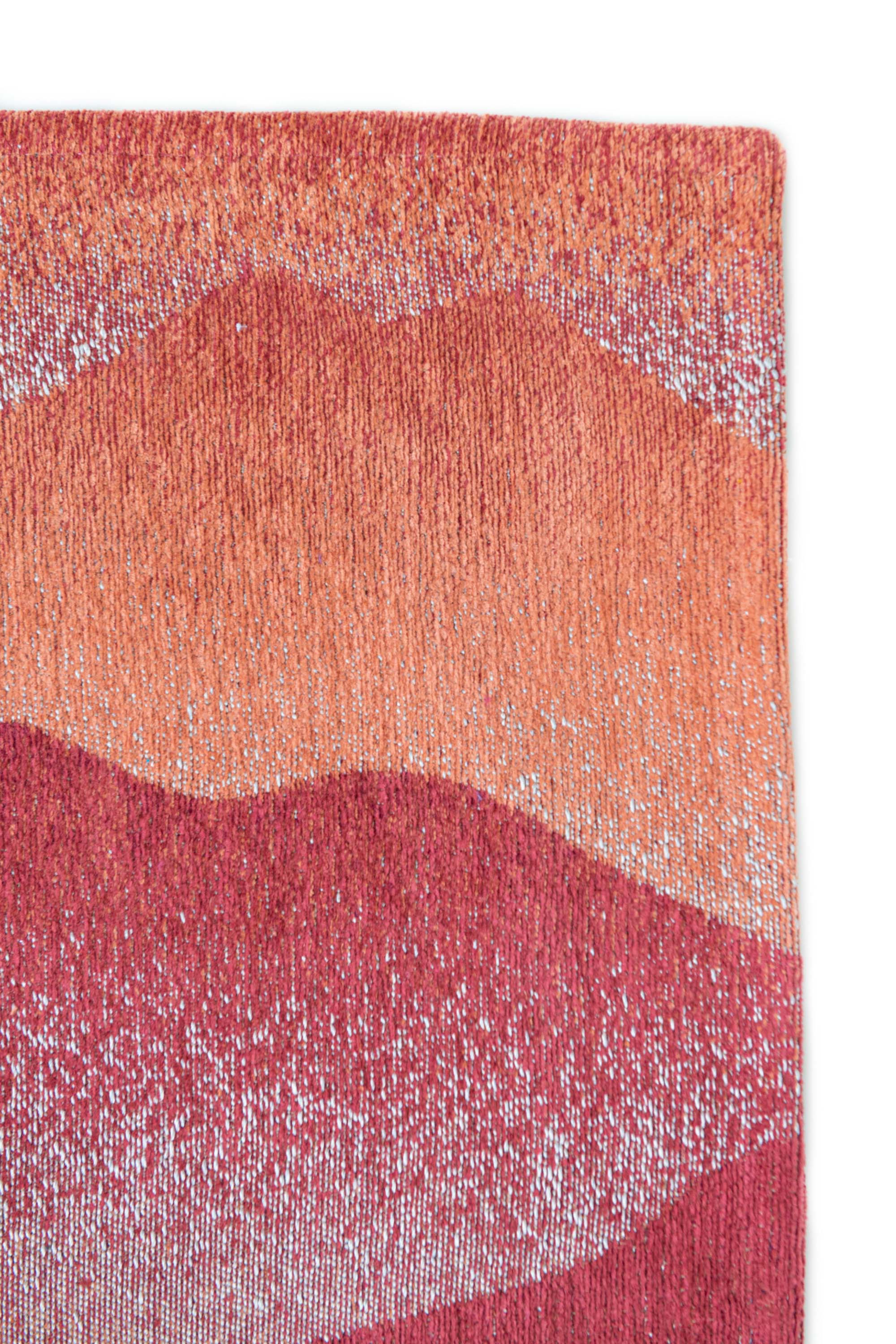 Modern rug with red abstract mountain range pattern