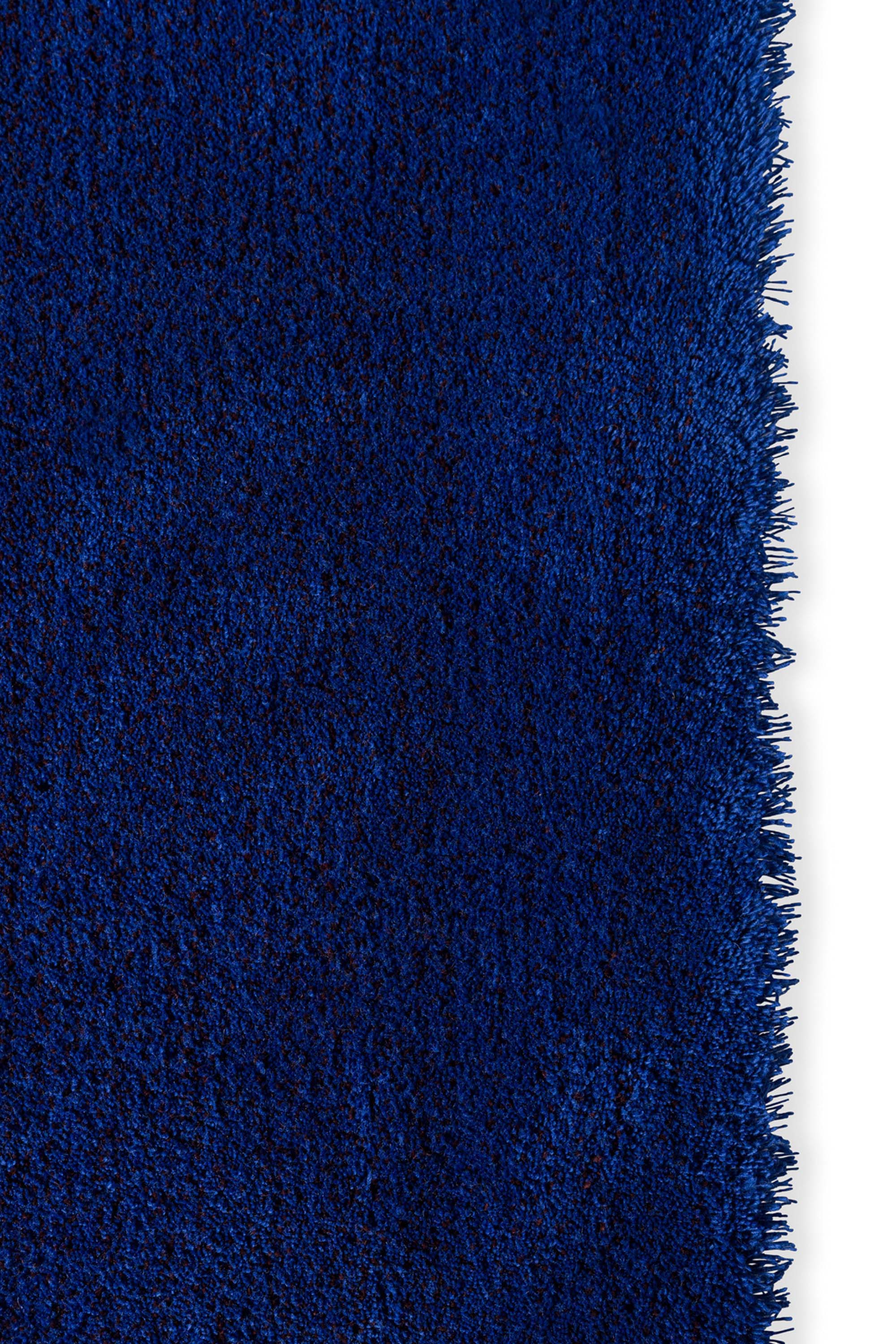 Plain blue rug with textured pile