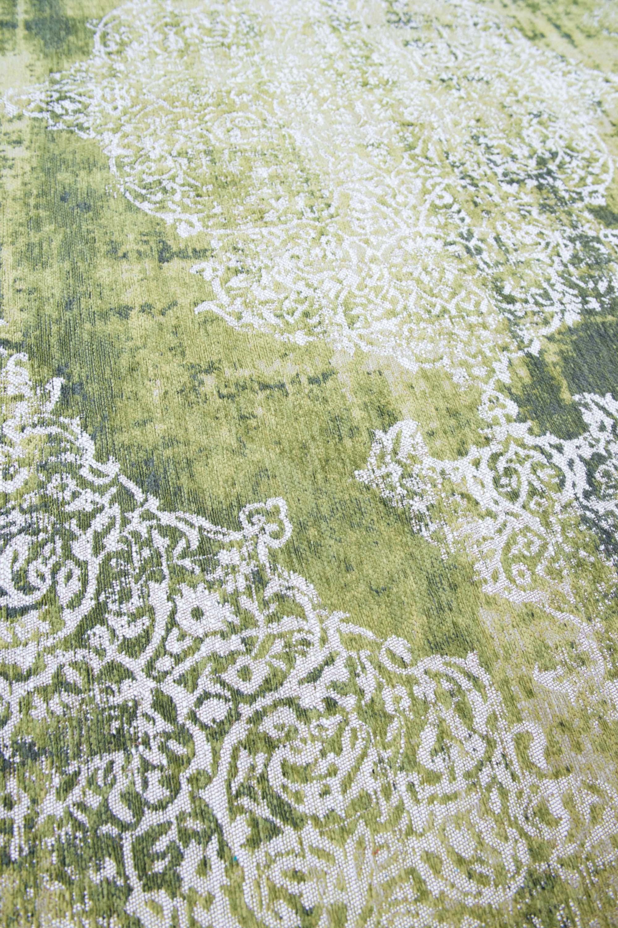 Green vintage Kirman-inspired rug with faded medallion pattern