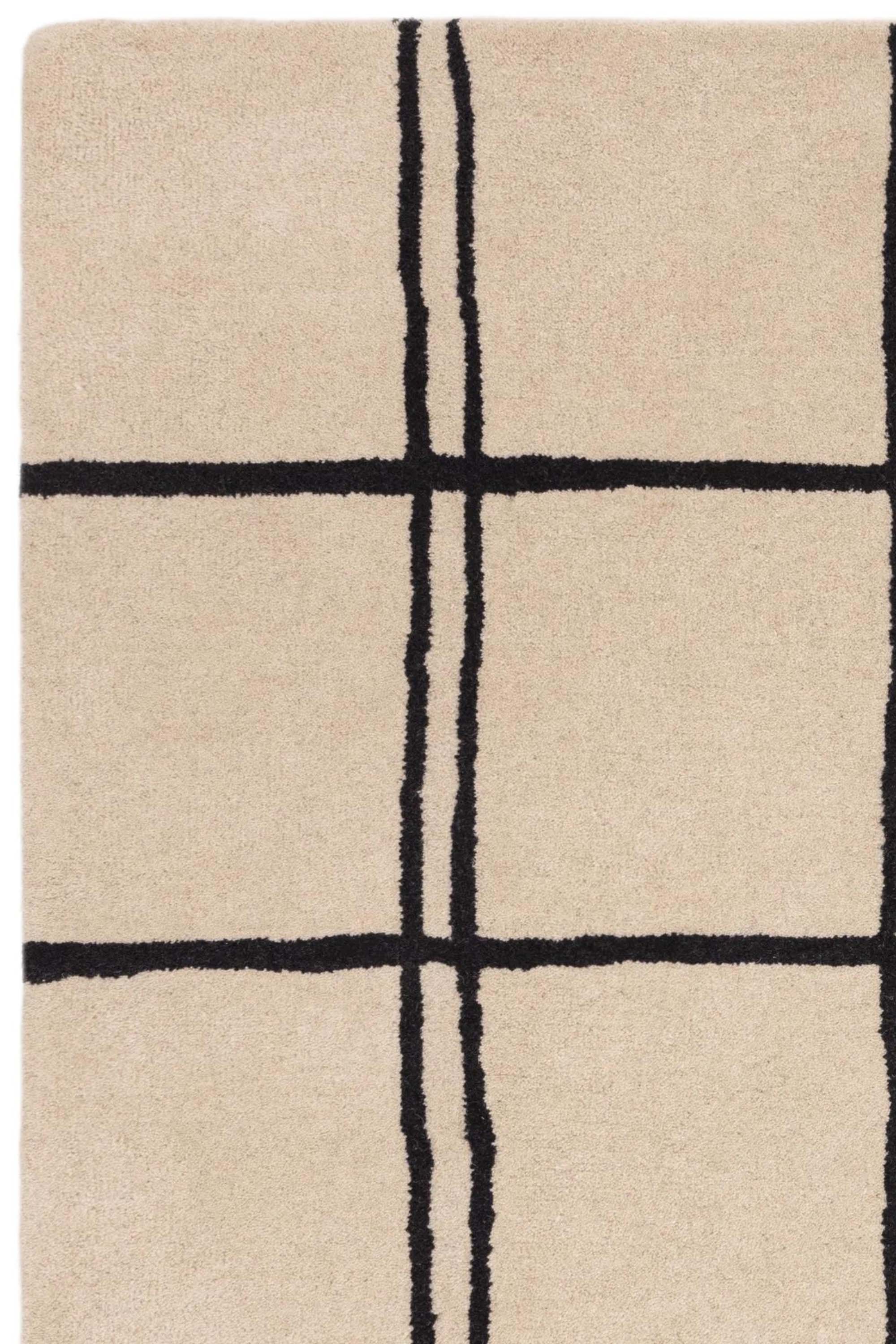 Monochrome rug with minimal geometric pattern 