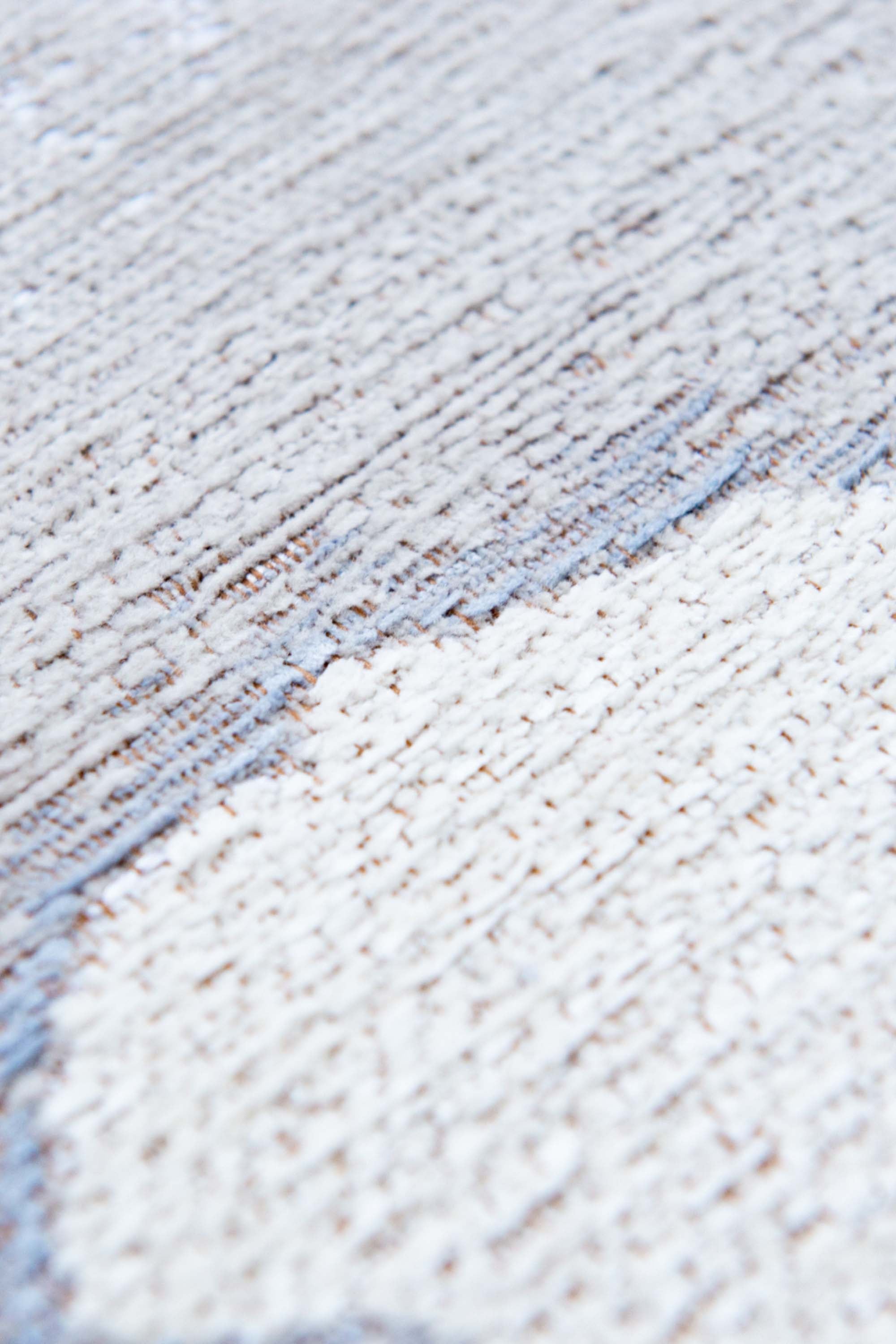 Modern rug with grey abstract shoreline pattern