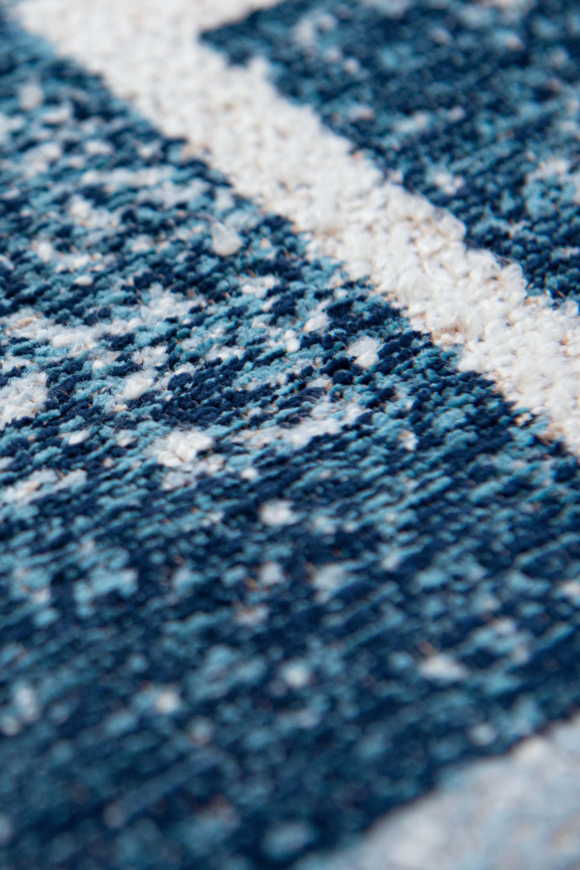 Modern abstract rug with blue stacked pattern