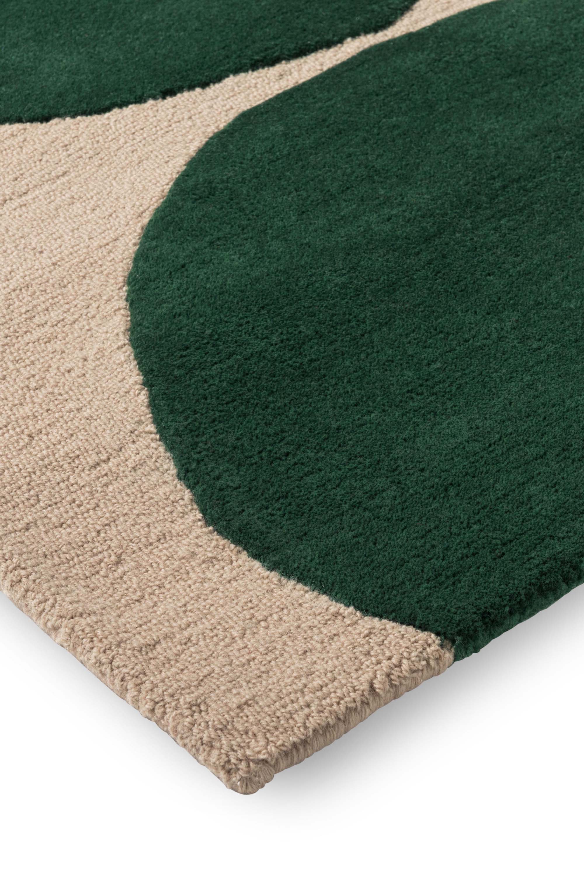 Beige rug with green repeated circle pattern