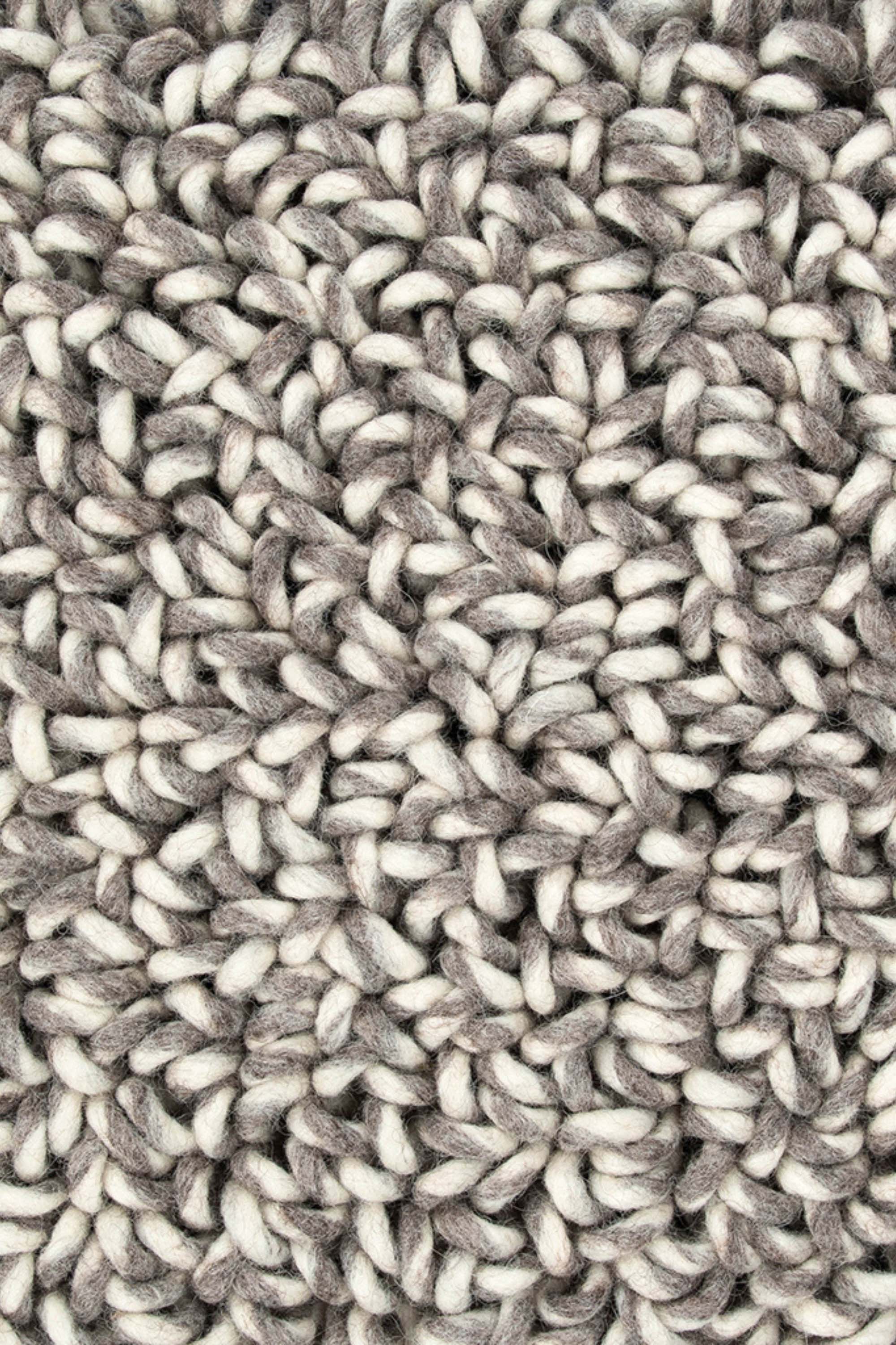 Plain dark grey rug with looped pile