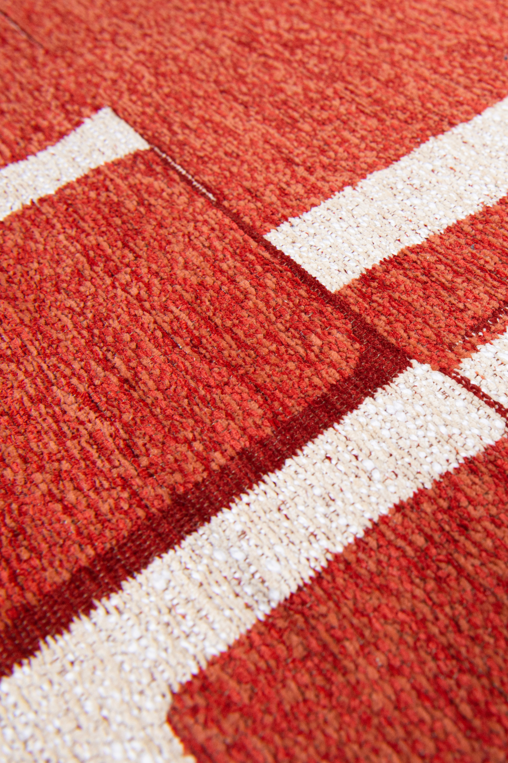 Modern abstract rug with red patchwork pattern