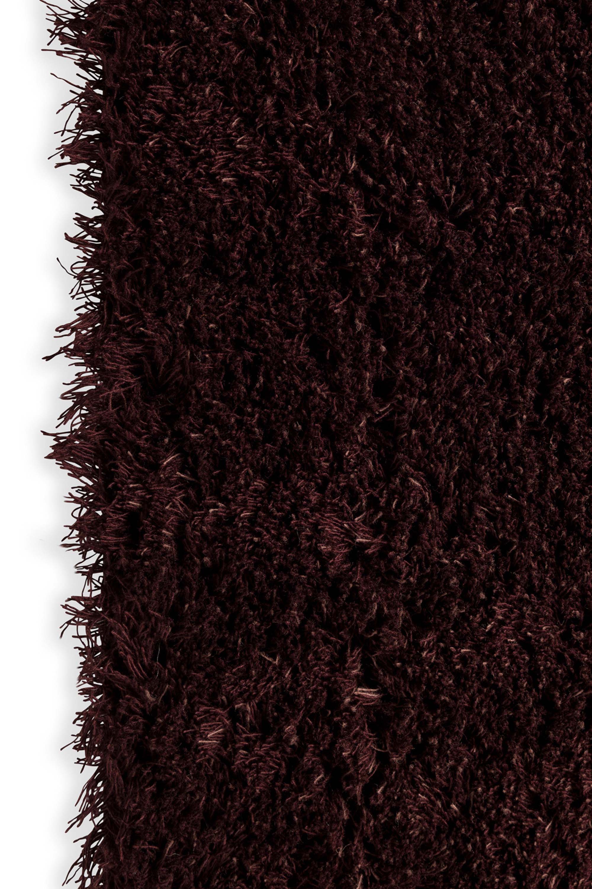 Plain red rug with shaggy pile
