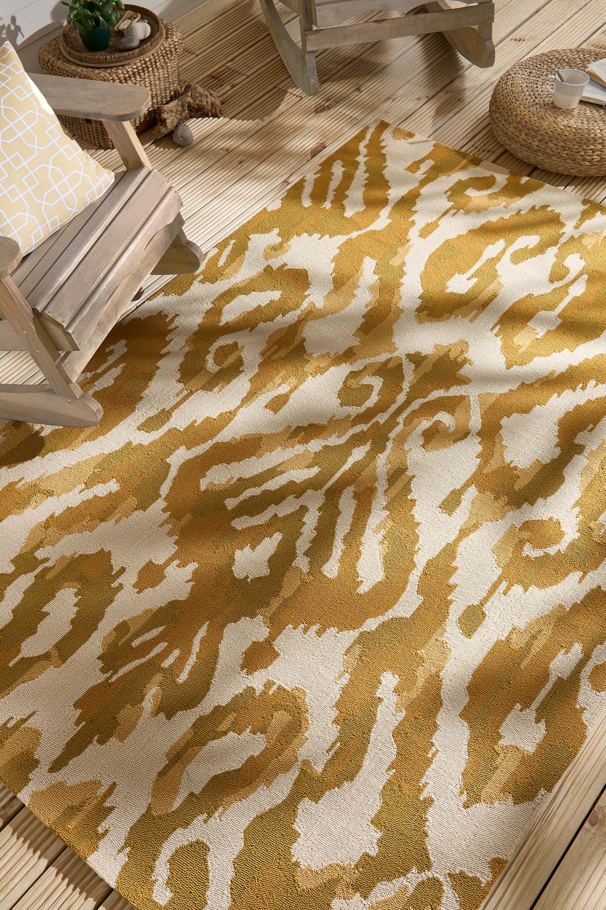 yellow indoor/outdoor rug with abstract pattern