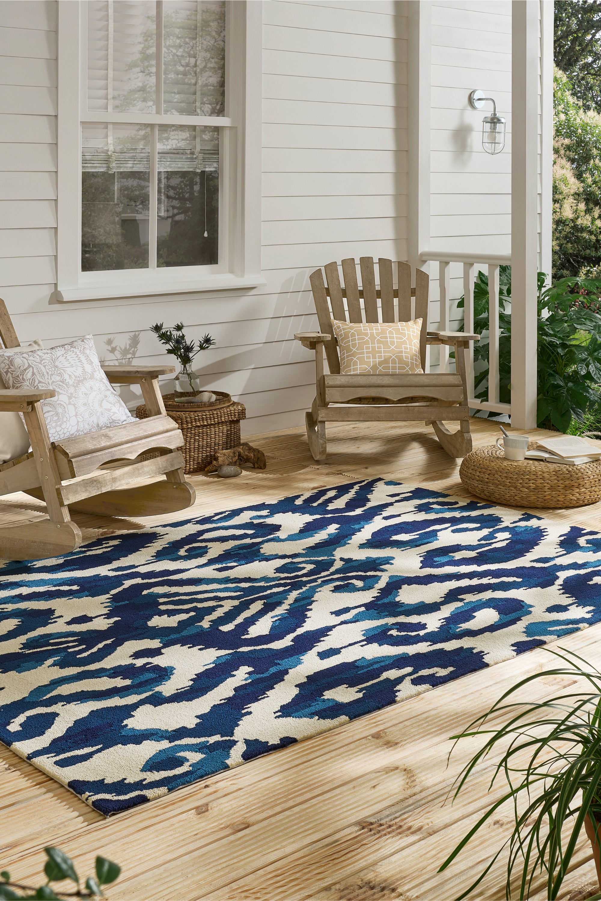 blue indoor/outdoor rug with abstract pattern