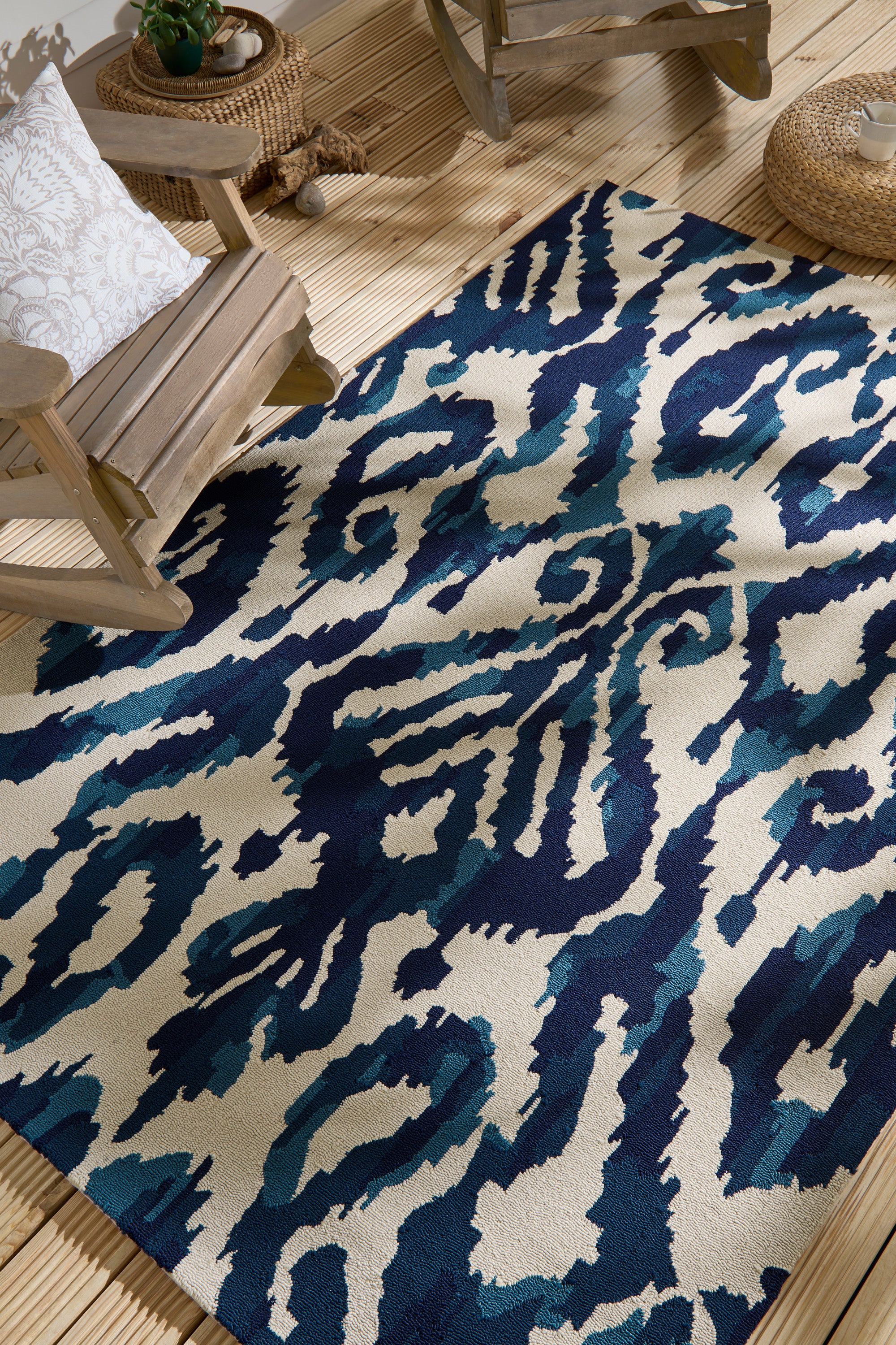 blue indoor/outdoor rug with abstract pattern