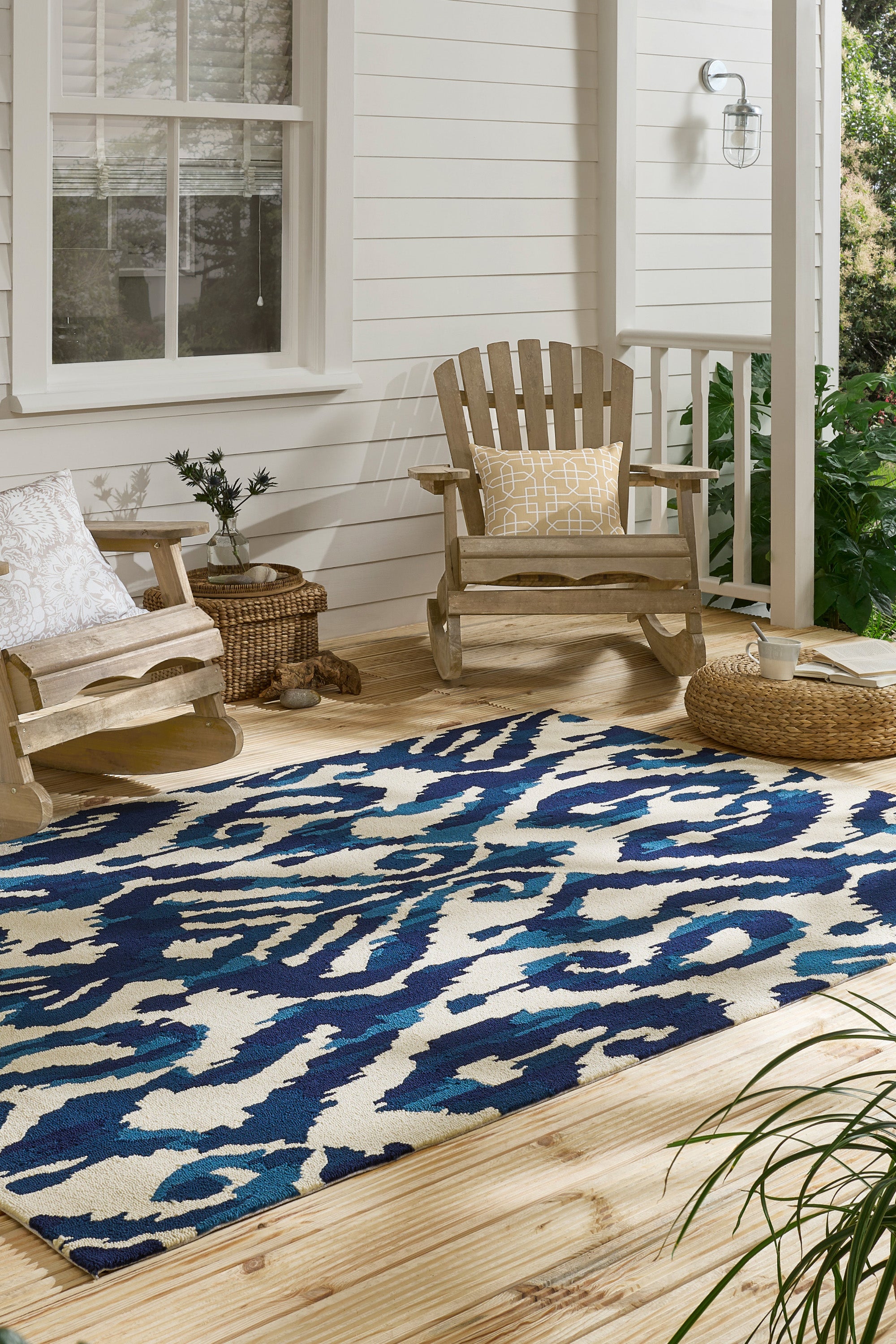 blue indoor/outdoor rug with abstract pattern