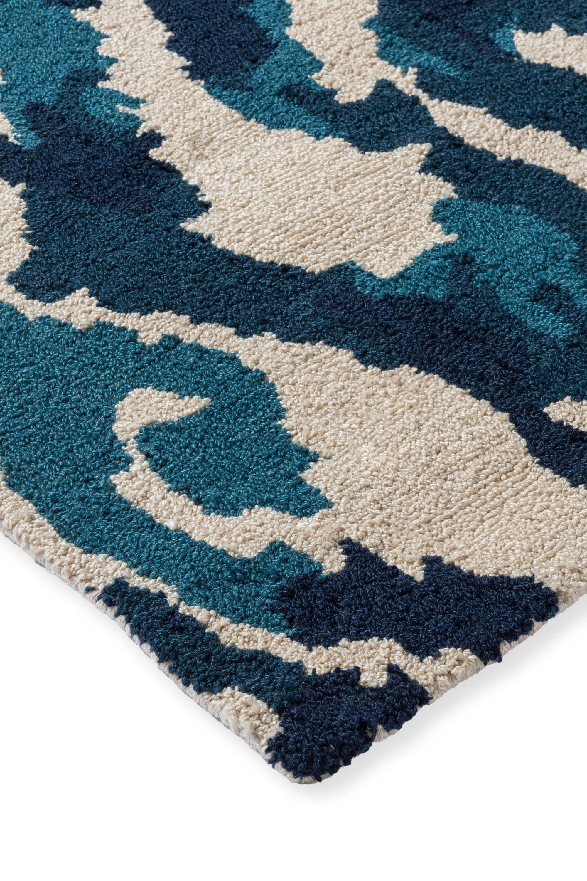 blue indoor/outdoor rug with abstract pattern