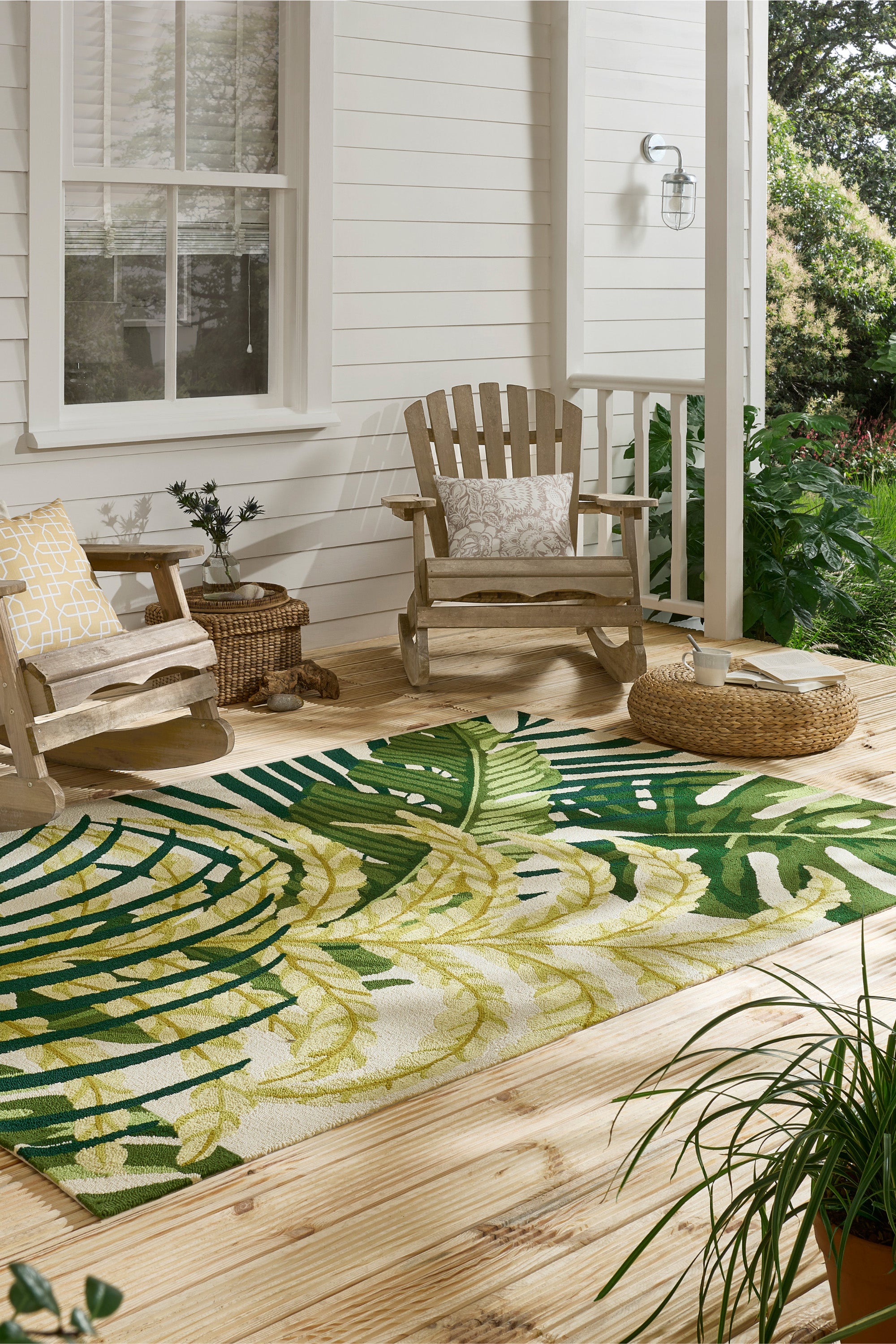 green indoor/outdoor rug with floral pattern