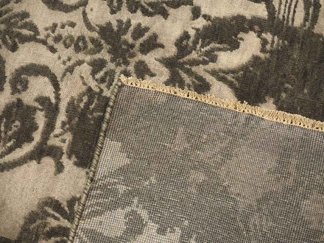 Authentic oriental rug with a damask pattern in beige and brown