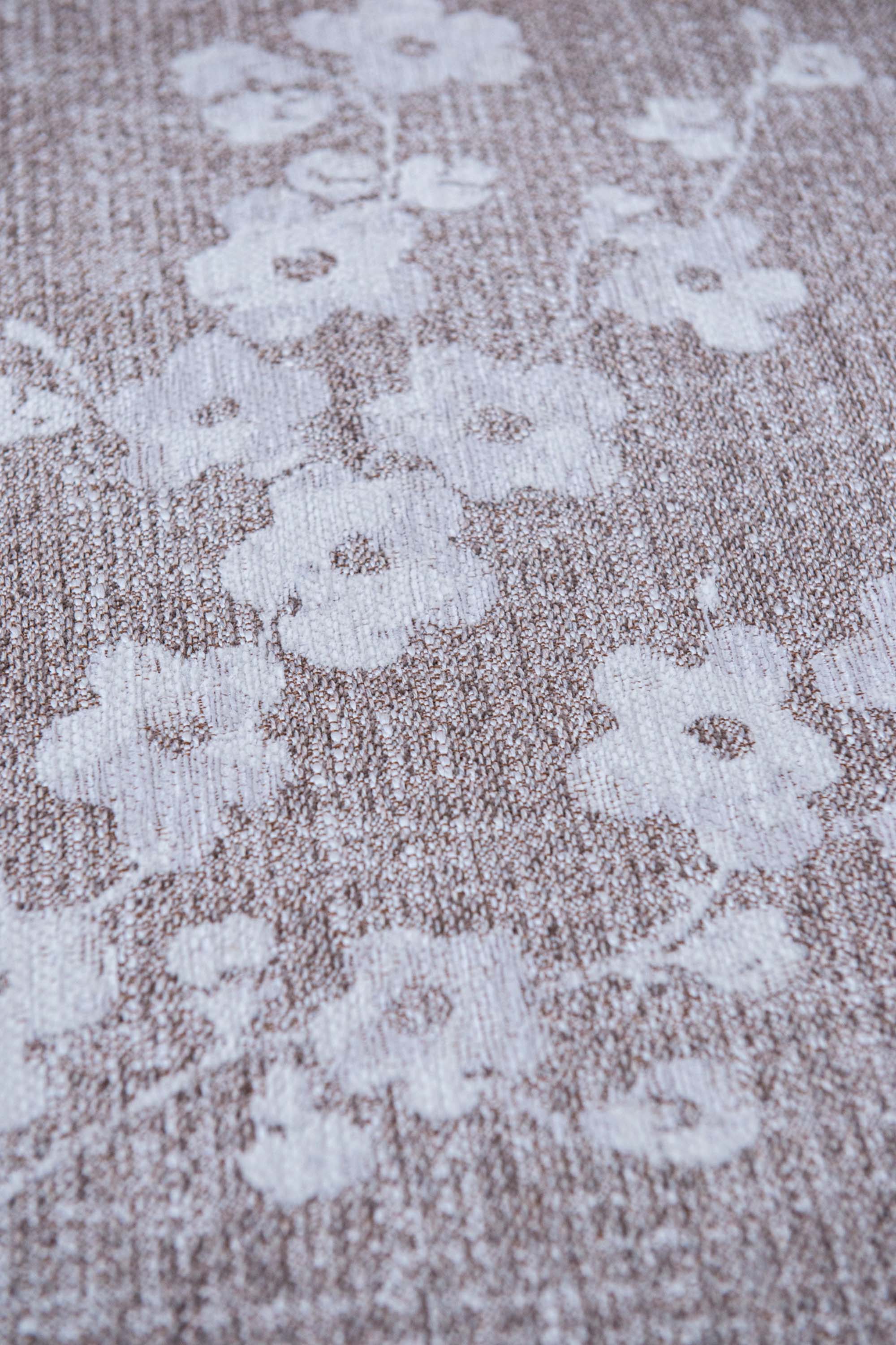Modern abstract rug with subtle beige floral pattern
