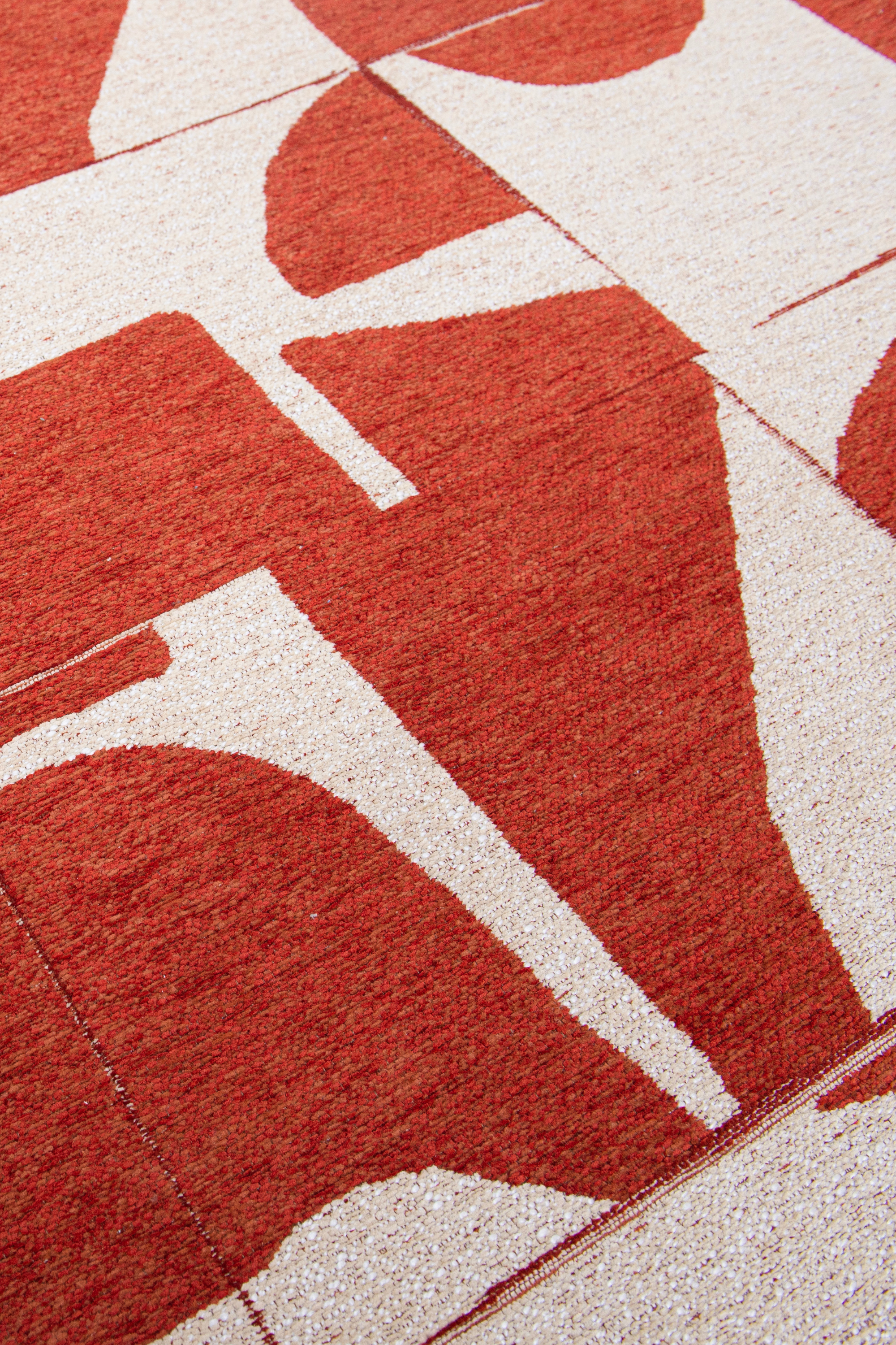 Modern abstract rug with red patchwork pattern