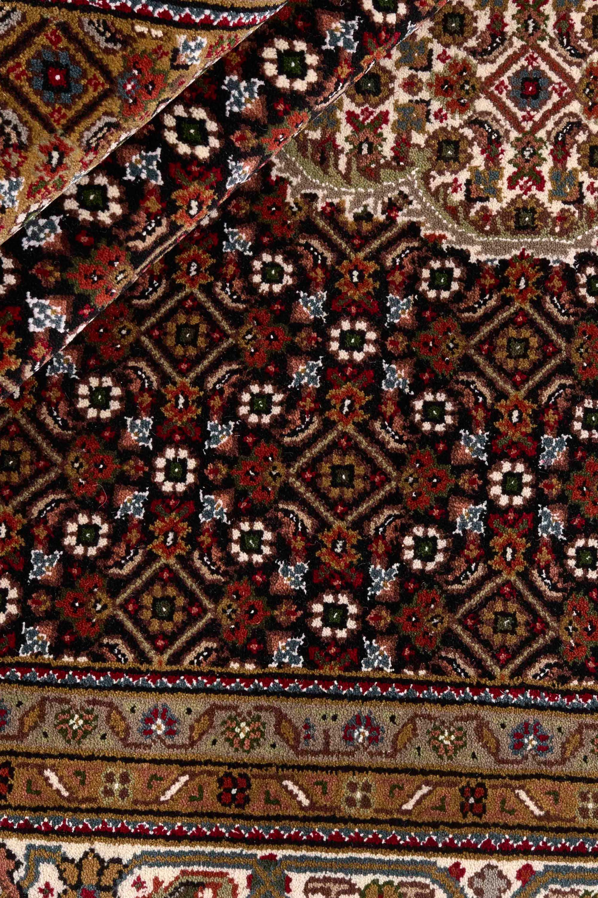 Traditional bordered Tabriz Indi rug