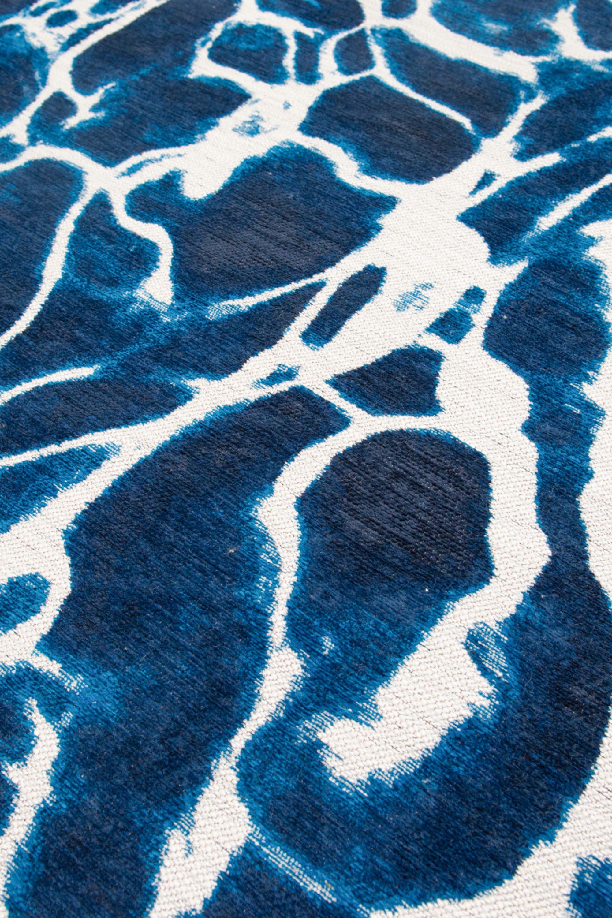 Modern runner rug with blue abstract water inspired pattern