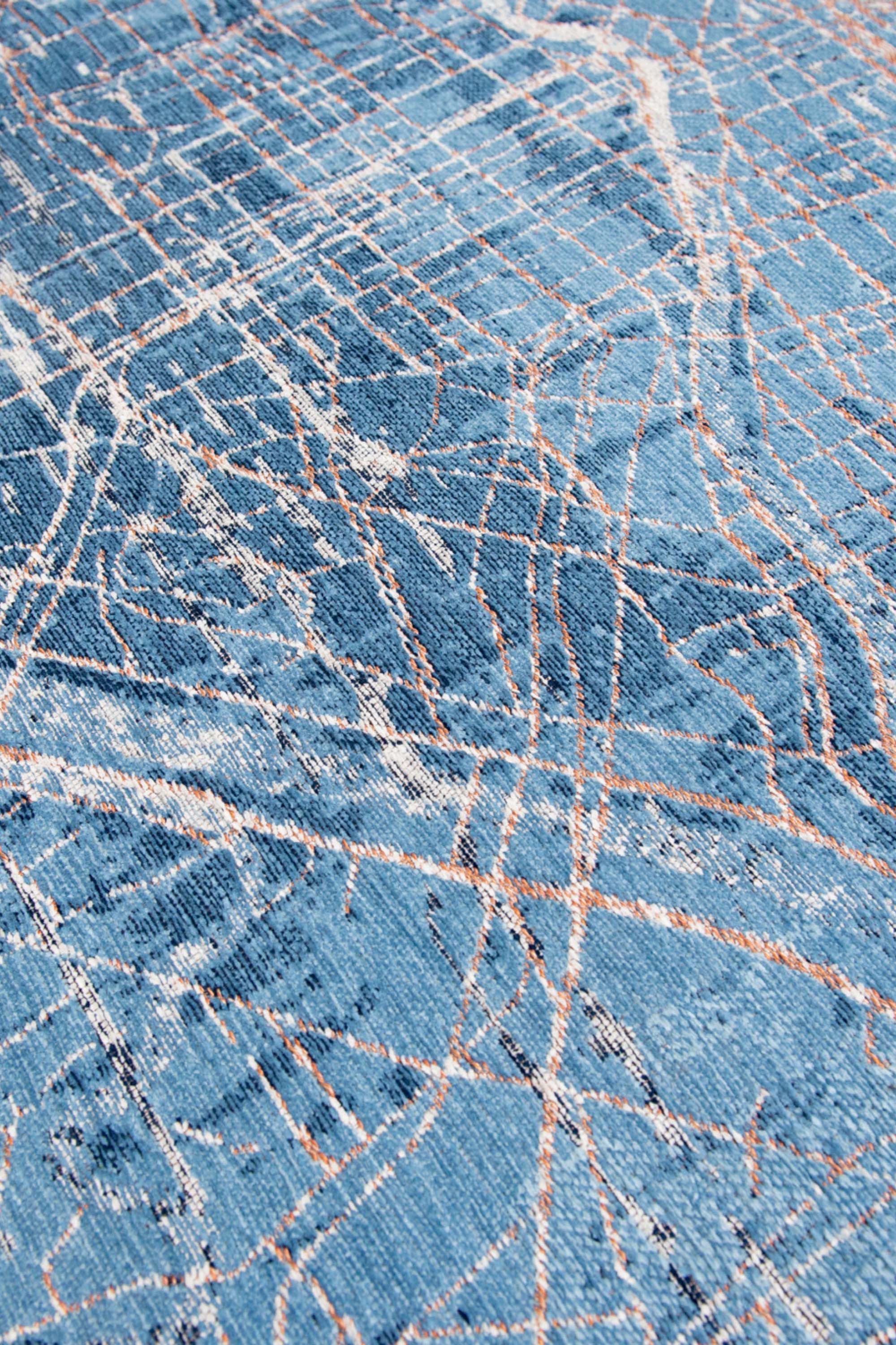 Blue abstract rug with a pattern inspired by the map of Tokyo