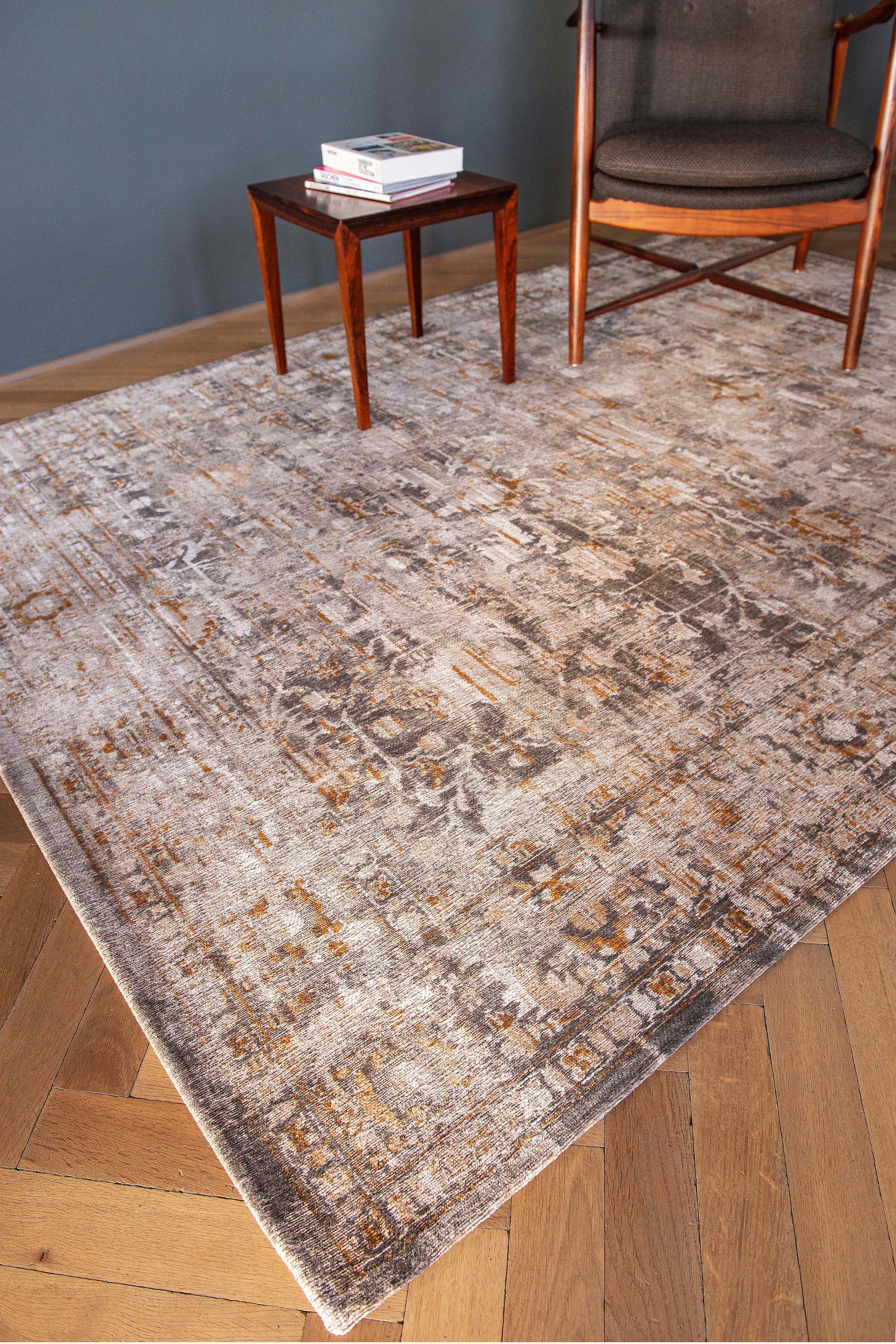 Distressed beige rug with turkish floral medallions and border in gold and grey