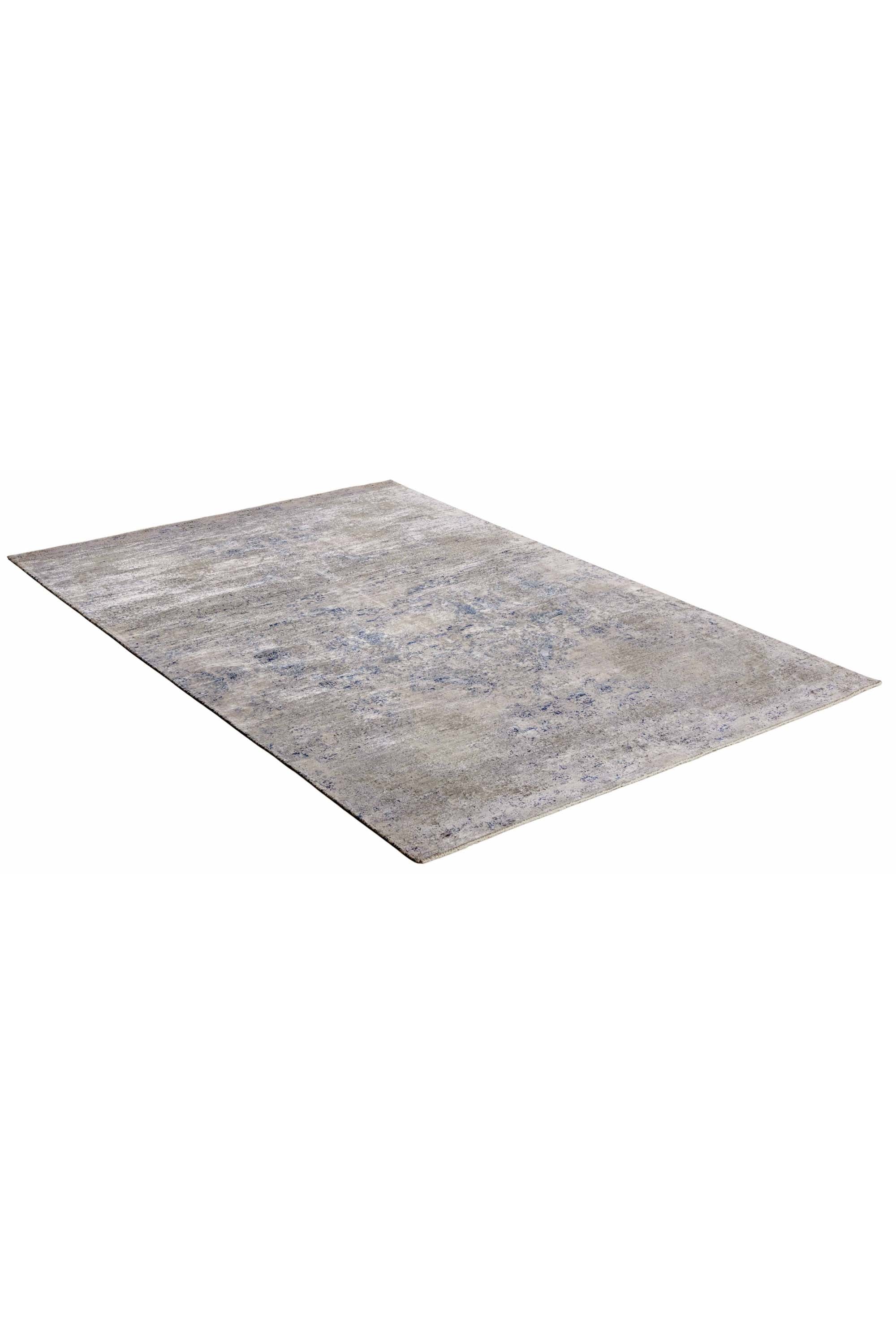 Modern luxury abstract rug in shades of silver and blue