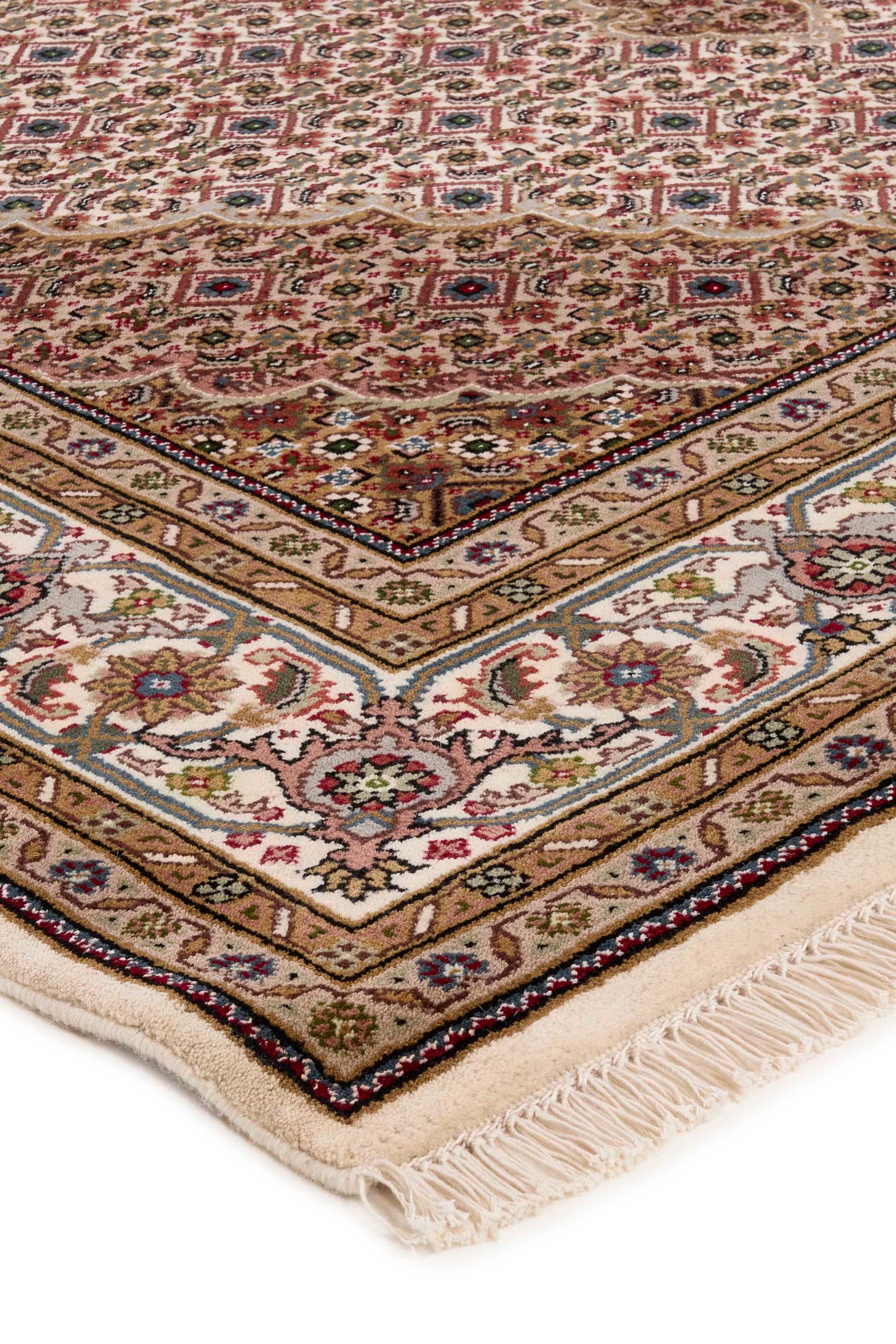 Traditional bordered brown Tabriz rug