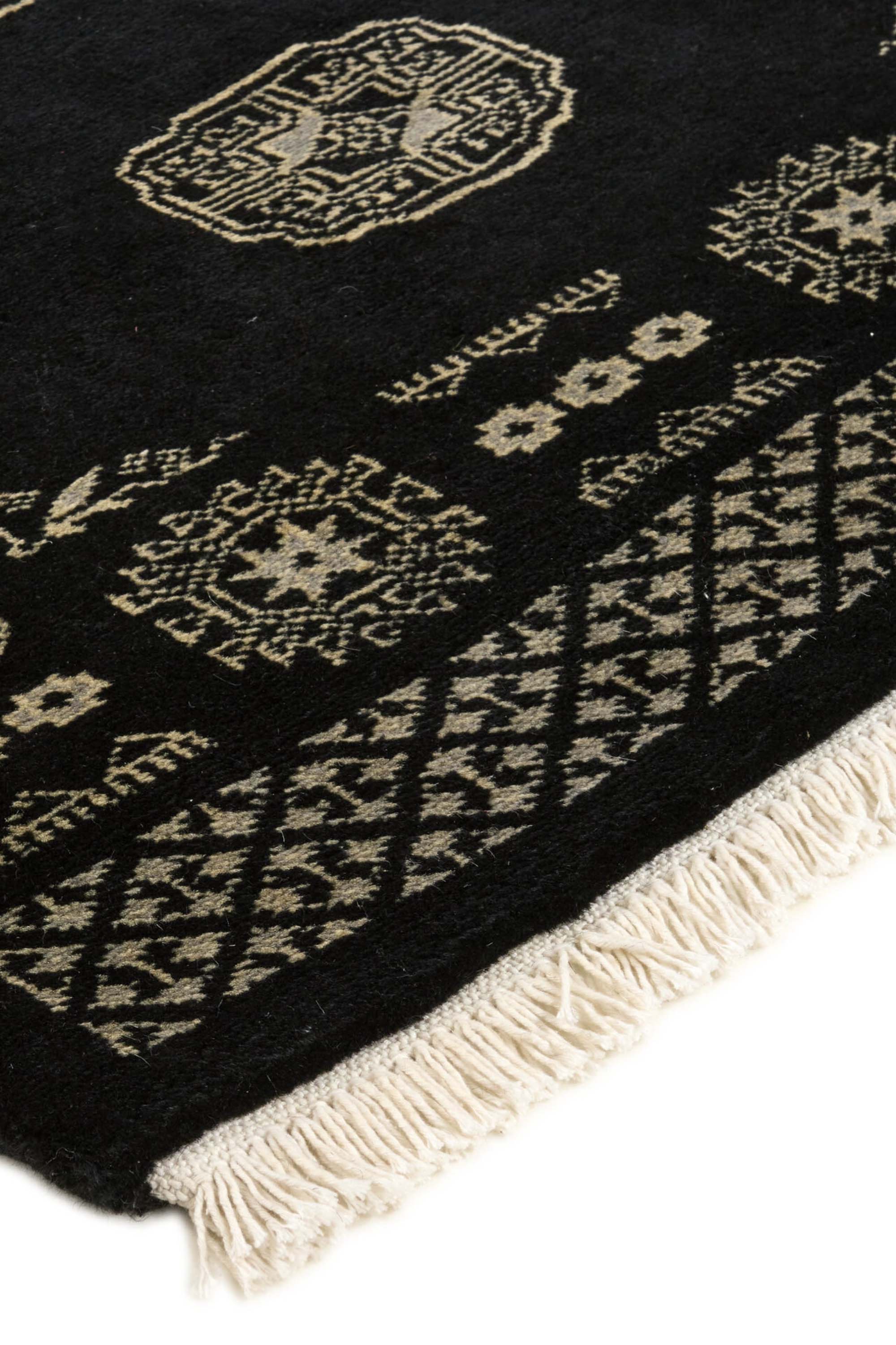 Black Oriental Bokhara 3 ply rug with bordered pattern