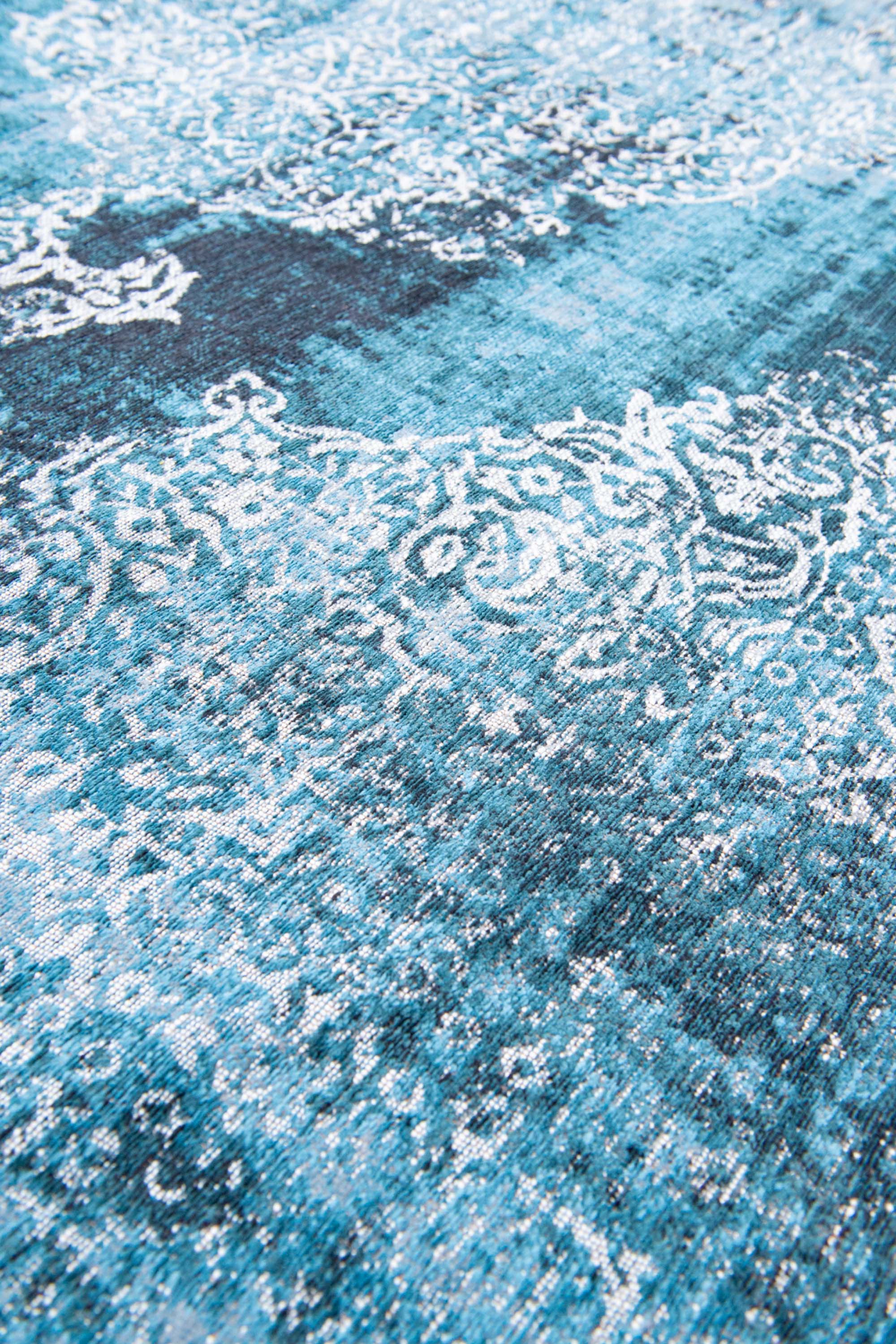 Blue vintage Kirman-inspired rug with faded medallion pattern