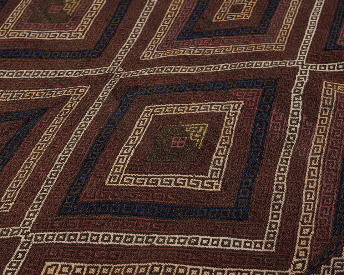  Brown, black, and red traditional Afghan rug