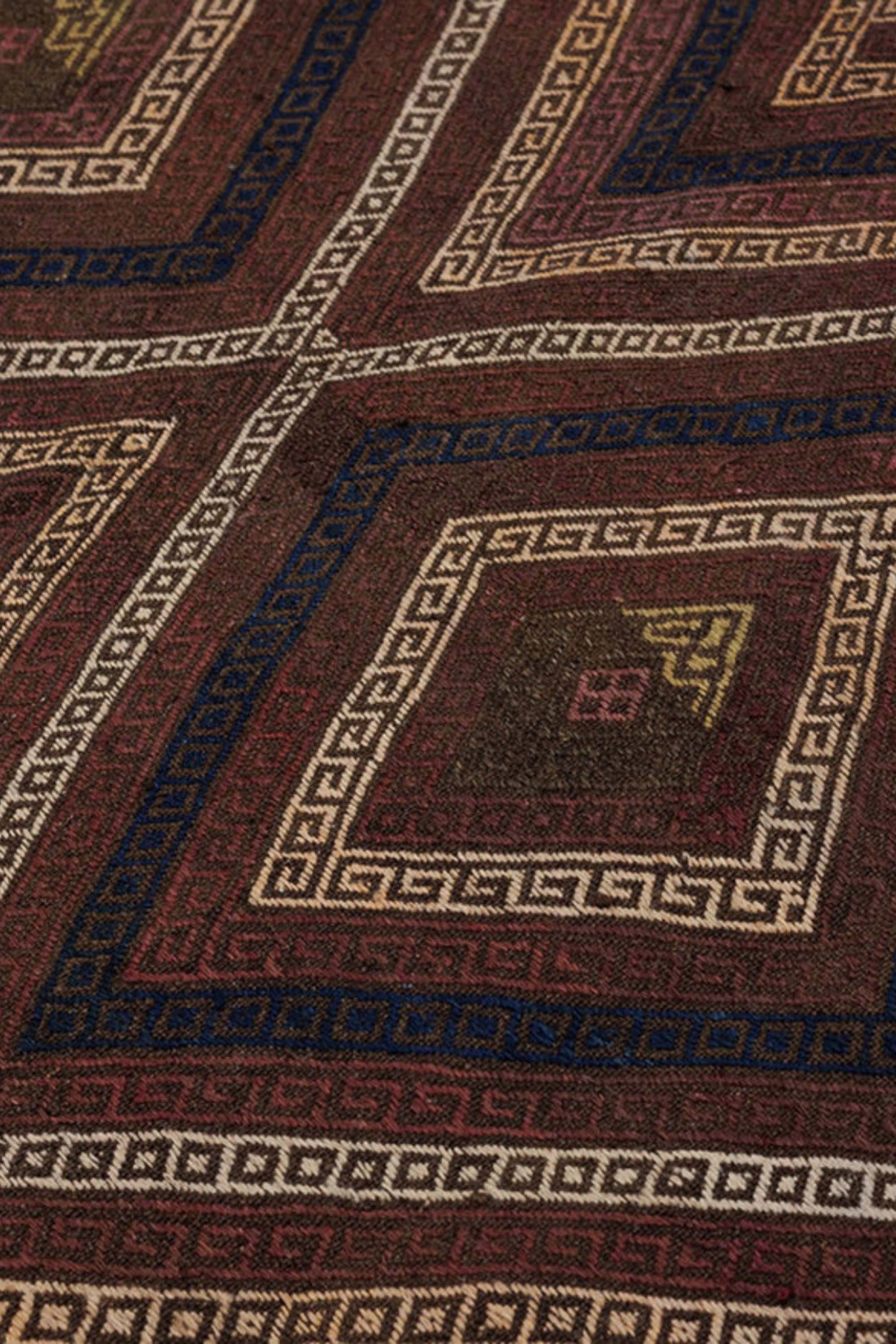 Brown, black, and red traditional Afghan rug