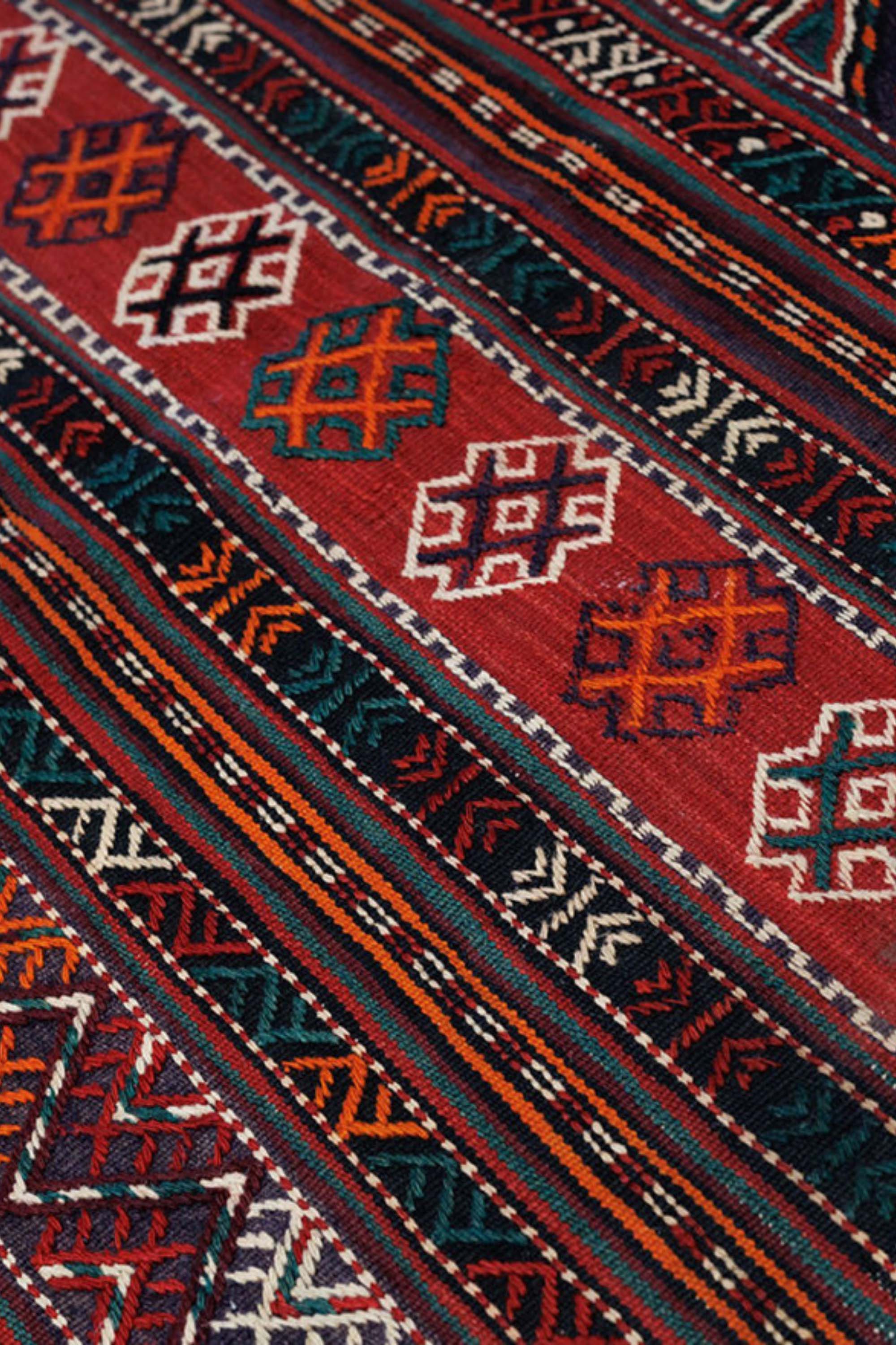 authentic afghan soumak runner with traditional multicolour geometric pattern in red